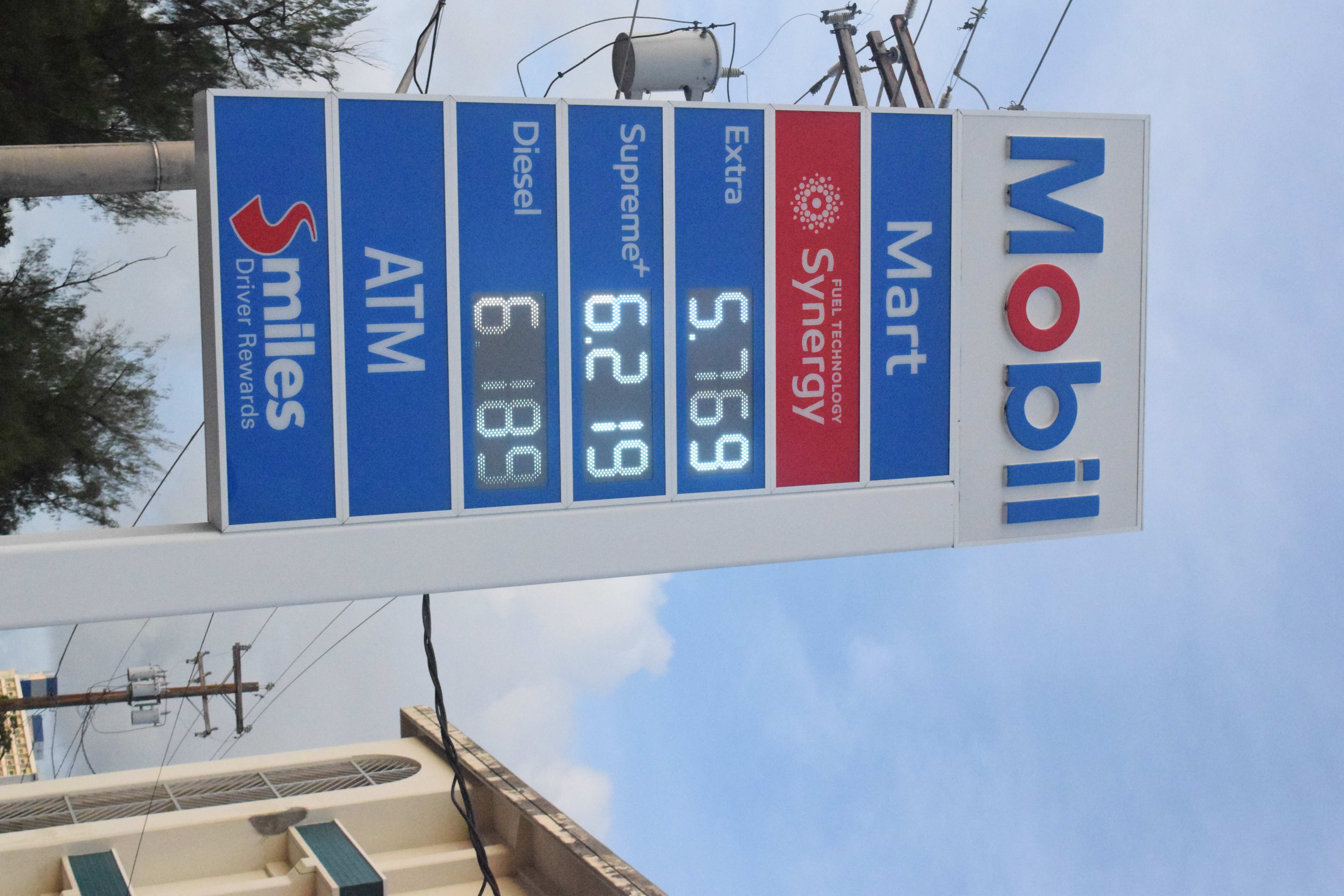 The Mobil Oil Marianas in Susupe displays its new prices on Monday.