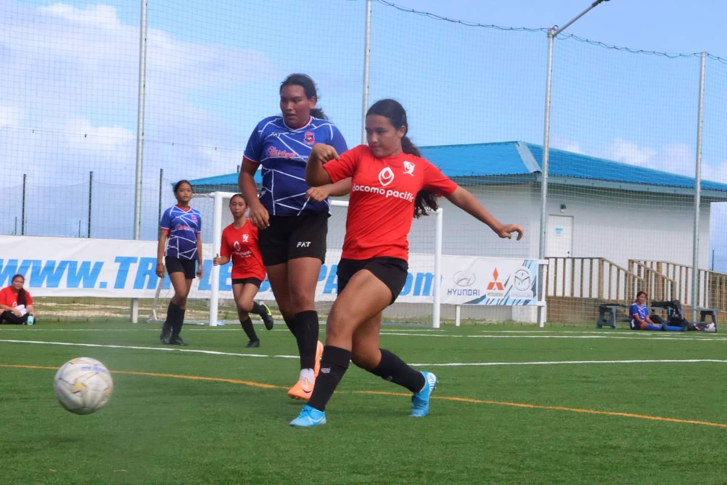 Paire Football Club's Windsor Gross and a Shirley's Football Club player battle for the possession during a U14 girls division game of the TakeCare Youth Soccer League Fall 2023 at the NMI Soccer Training Center in Koblerville.