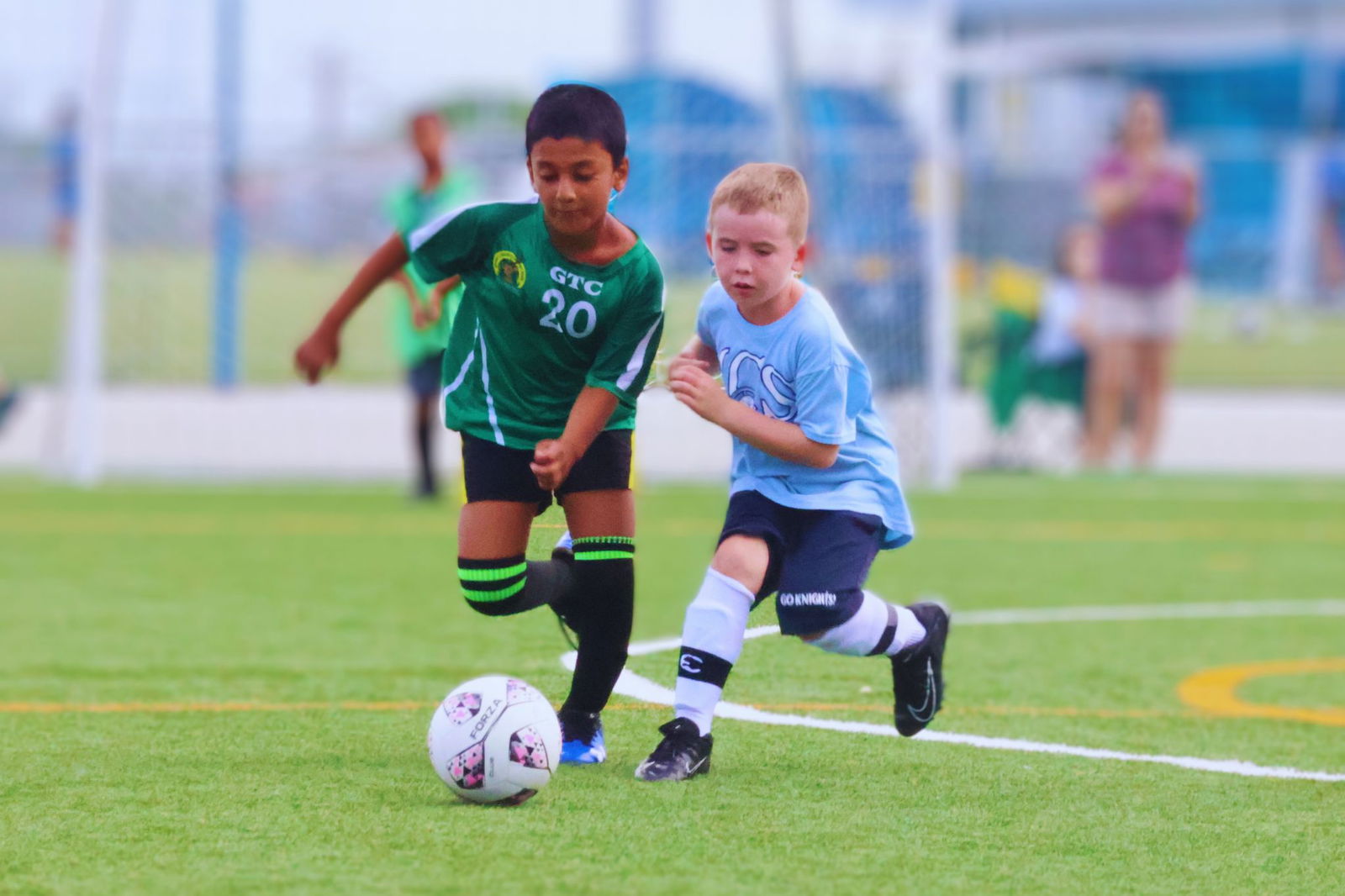 Gregorio T. Camacho Elementary School's Tawheen Ullah and a Mount Carmel School 2 player race to control the possession during an elementary school division game of the NMIFA-PSS Interscholastic Soccer League SY 23-24 on Monday at the NMI Soccer Training Center in Koblerville.