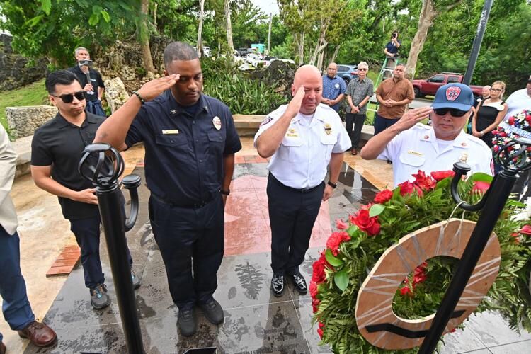 First responders hang a wreath representing the Twin Towers at the Peace Ceremony & Tribute in remembrance of Sept. 11 Monday Sept. 11, 2023 in Harmon.