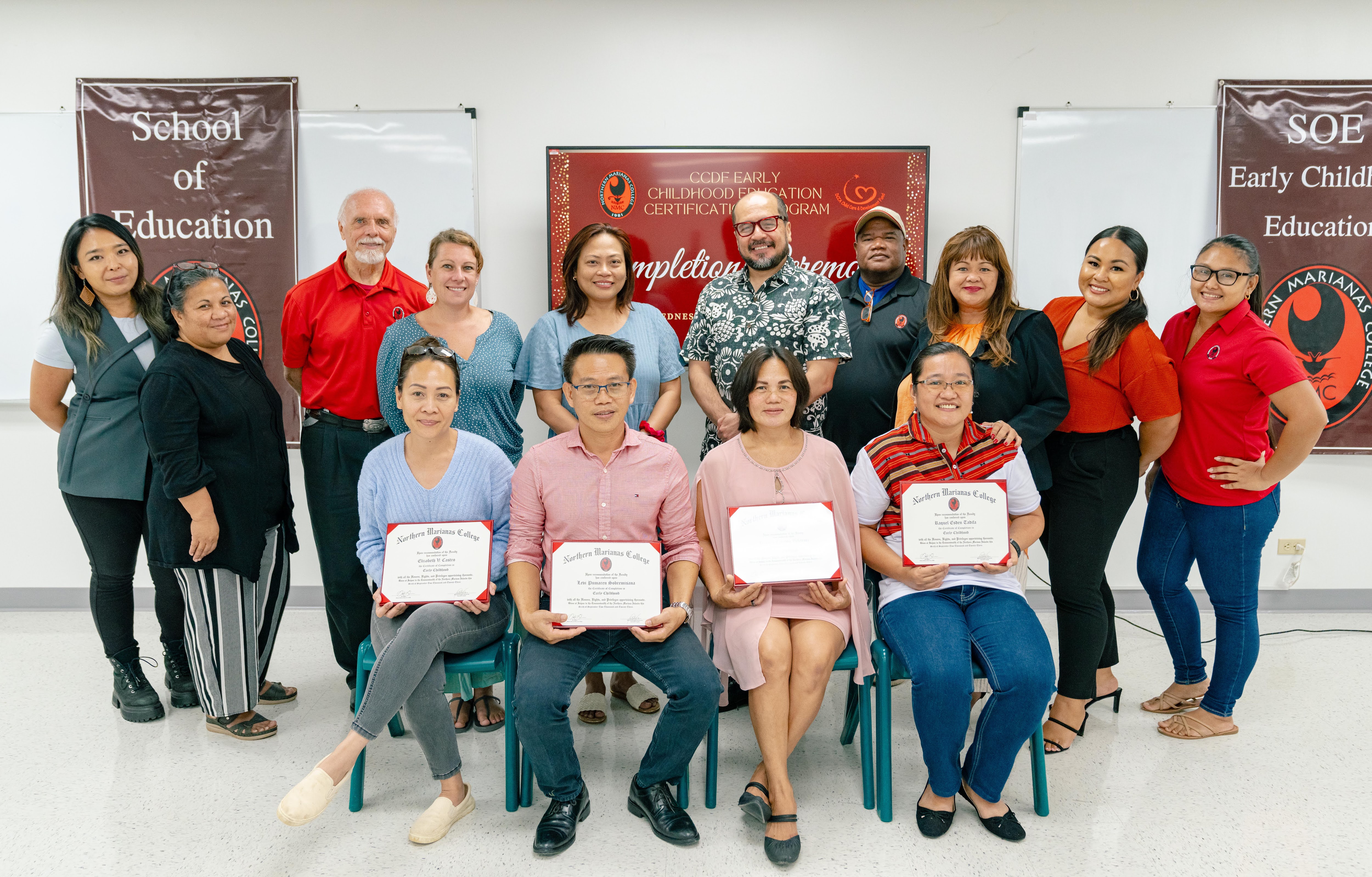 From left, NMC CDI Program Manager Geraldine Sasamoto, NMC SOE Assistant Professor for Elementary Education Resida Keller, NMC SOE Instructor Randy Yates, EdD, NMC SOE Instructor Sara Forti, DCCA-CCDF Administrator Maribel Loste, NMC President Galvin Deleon Guerrero, EdD, NMC SOE Director Roland Merar, NMC Dean of Student Support Services Charlotte Cepeda, NMC CDI Director Monique Boyer Saban, NMC CDI Administrative Assistant Pamela Ada. Seated from the left, Elizabeth Castro, Levi Sobremisana, Rosana Villaraiz, and Raquel Tadifa. Not in the photo is graduate Clarinda Aldan.