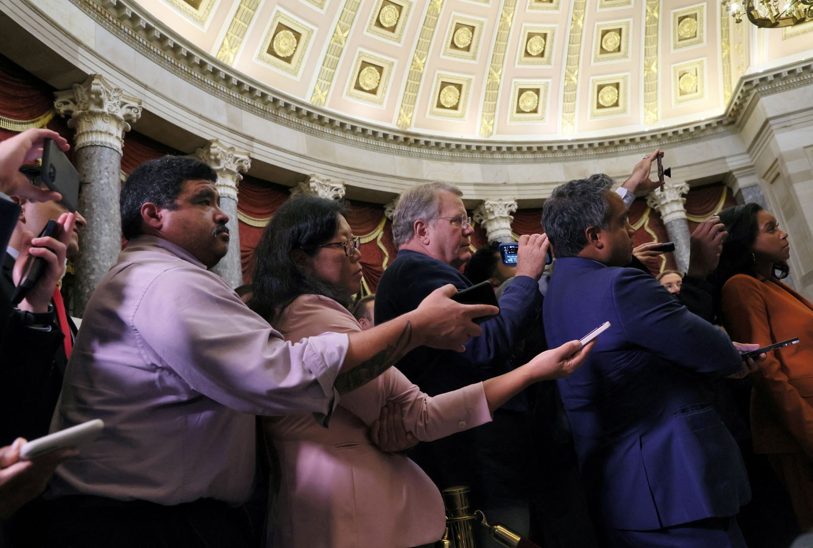 Members of the media record and listen as U.S. House Speaker Kevin McCarthy answers questions as the deadline to avert a government shutdown approaches on Capitol Hill in Washington, U.S., September 26, 2023. 