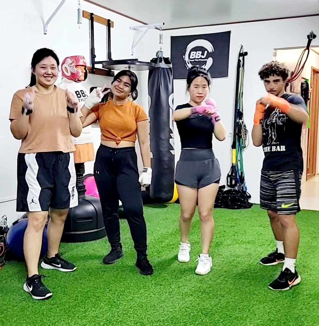 Some of the clients of National Academy of Sports Medicine Personal Trainer Jerry Diaz pose for a photo at BBJ Athletics.