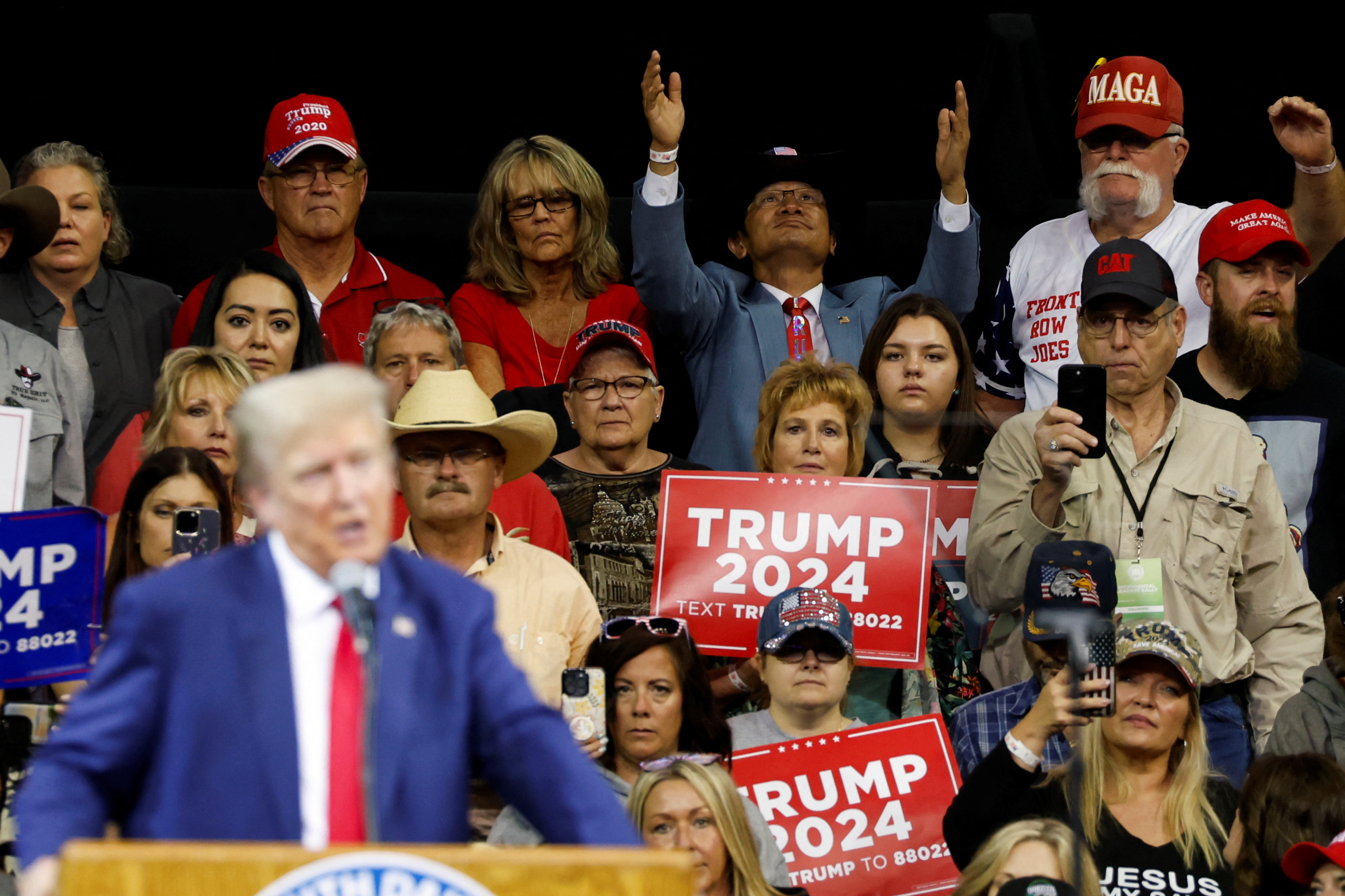 Supporters raise their hands as former U.S. President and Republican presidential candidate Donald Trump completes his remark at a South Dakota Republican party rally in Rapid City, South Dakota, U.S. September 8, 2023. REUTERS/Jonathan Ernst