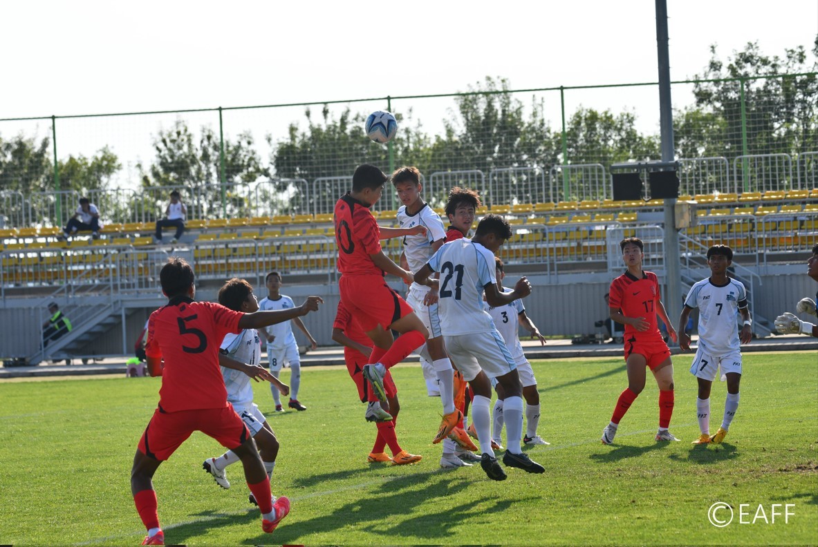 The NMI’s Moshe Sikkel and a Korea Republic player attempt a header in the battle for possession during a men’s U15 game of the East Asian Football Federation in Qingdao, China.