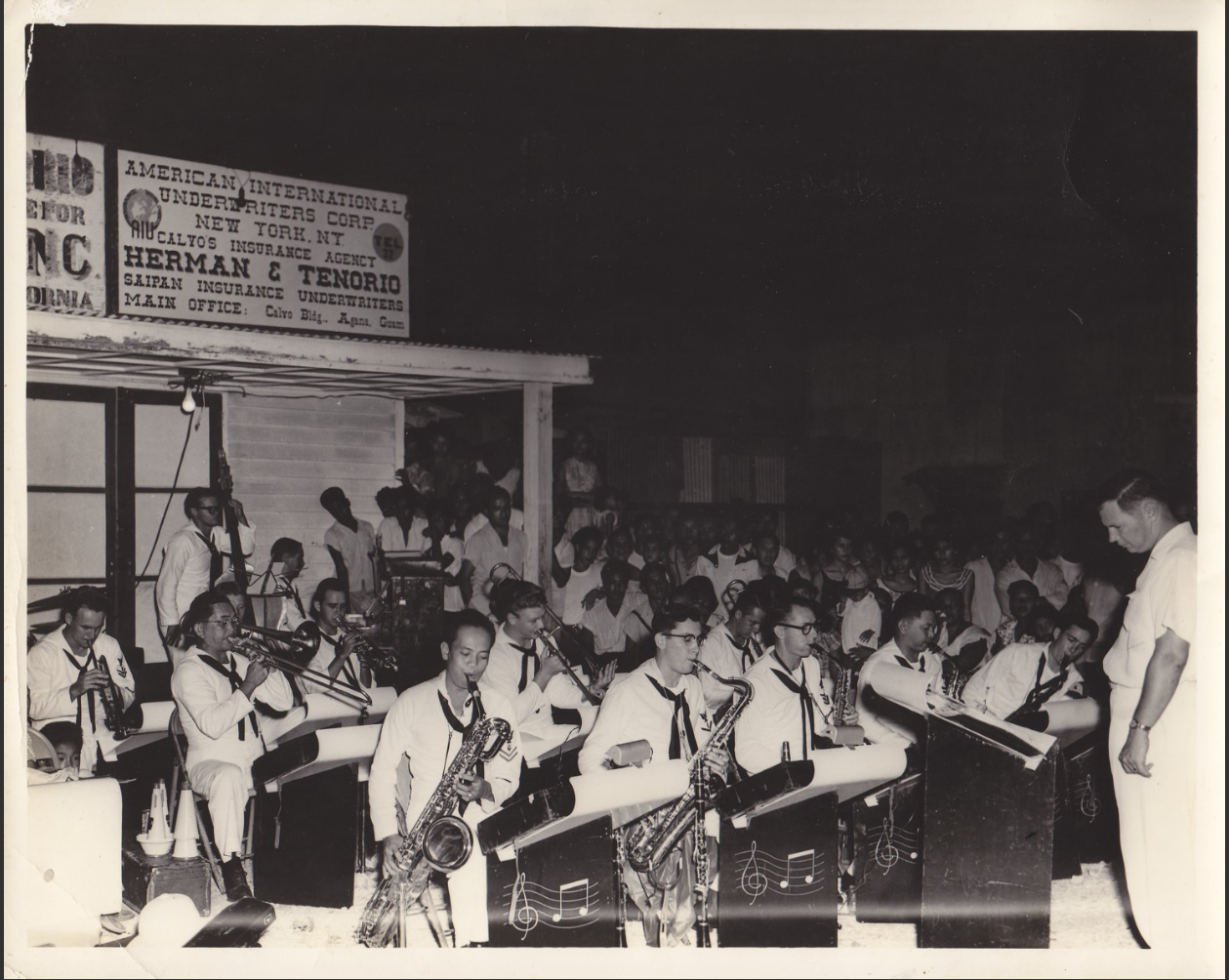 Naval band in front of original location of Herman's grocery store.