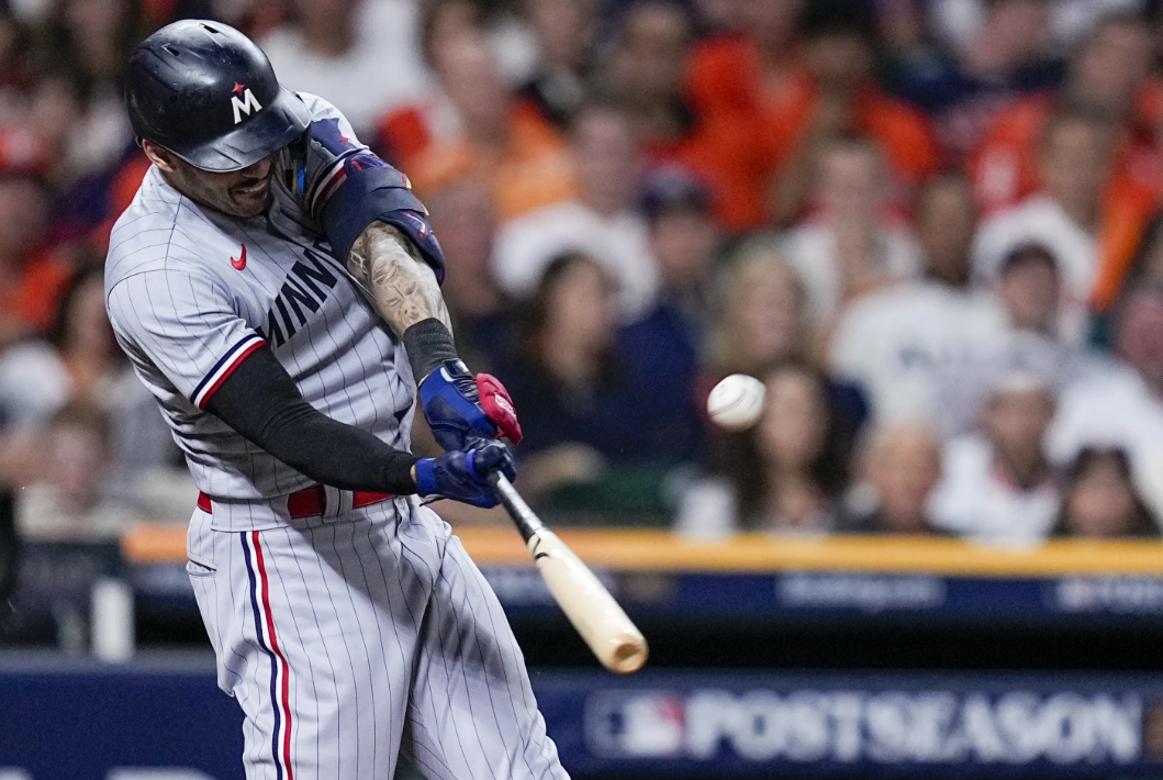 Minnesota Twins’ Carlos Correa hits an RBI-double against the Houston Astros during the first inning in Game 2 of an American League Division Series baseball game in Houston, Sunday, Oct. 8, 2023.