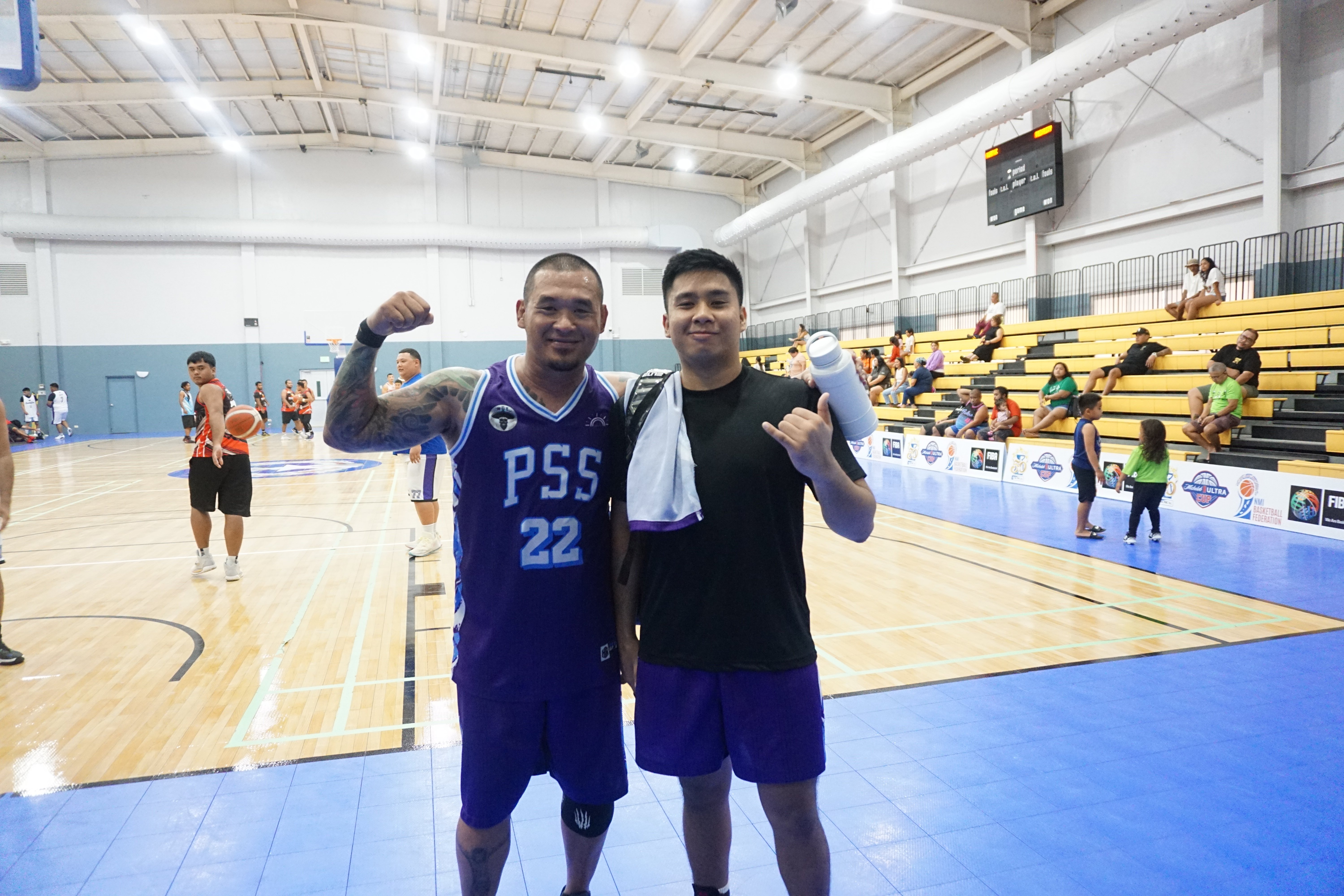 PSS' Ryan Mendiola and a teammate pose for a photo after their basketball game against Joeten in the 2023 R&J Wine and Liquor Inter-Government/Business League  at the Ada gym.