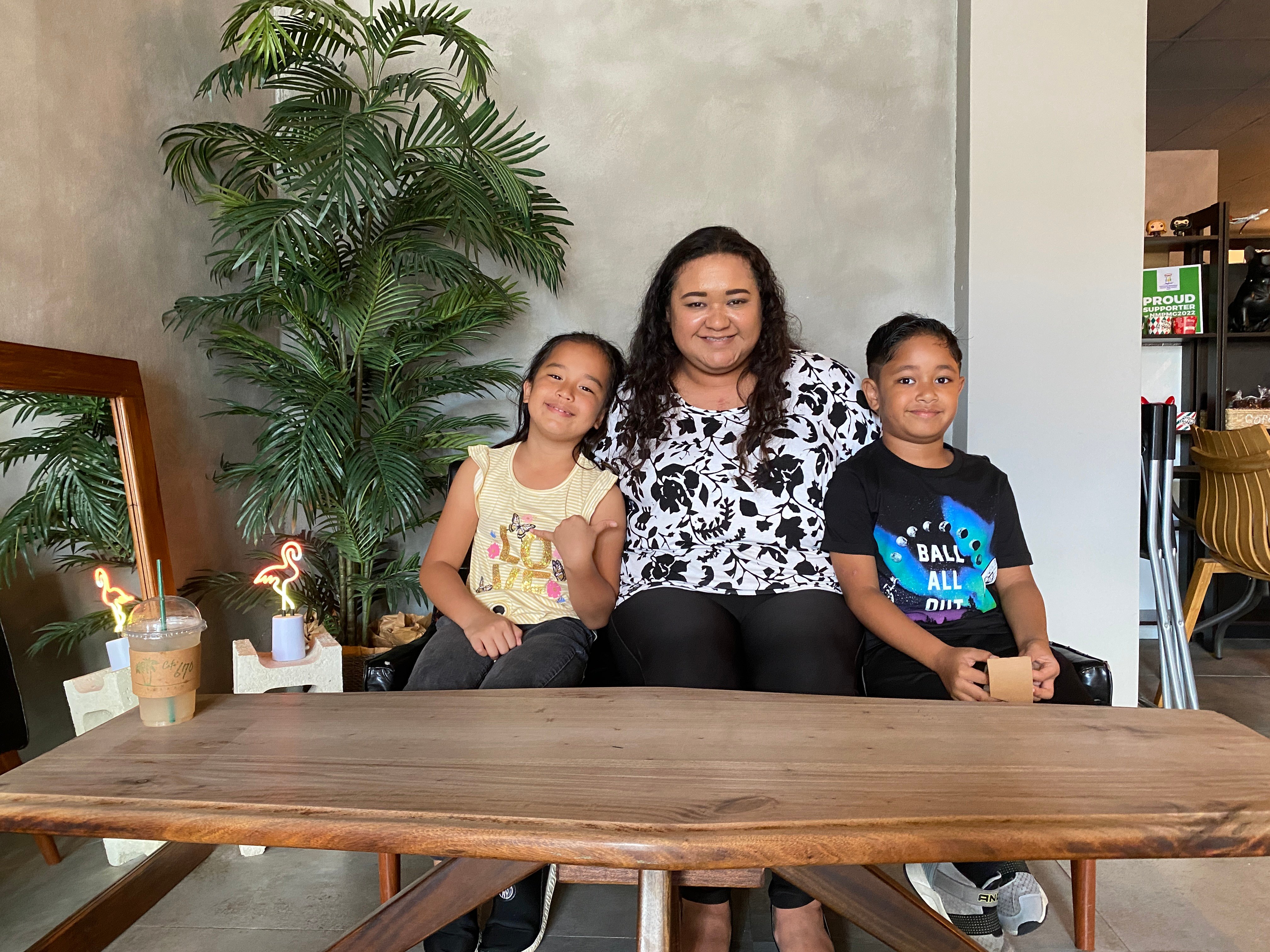Amber Mendiola-Romolor with her children, Connie, left, and Daydin, who will perform on stage at a benefit concert on Nov. 4. 