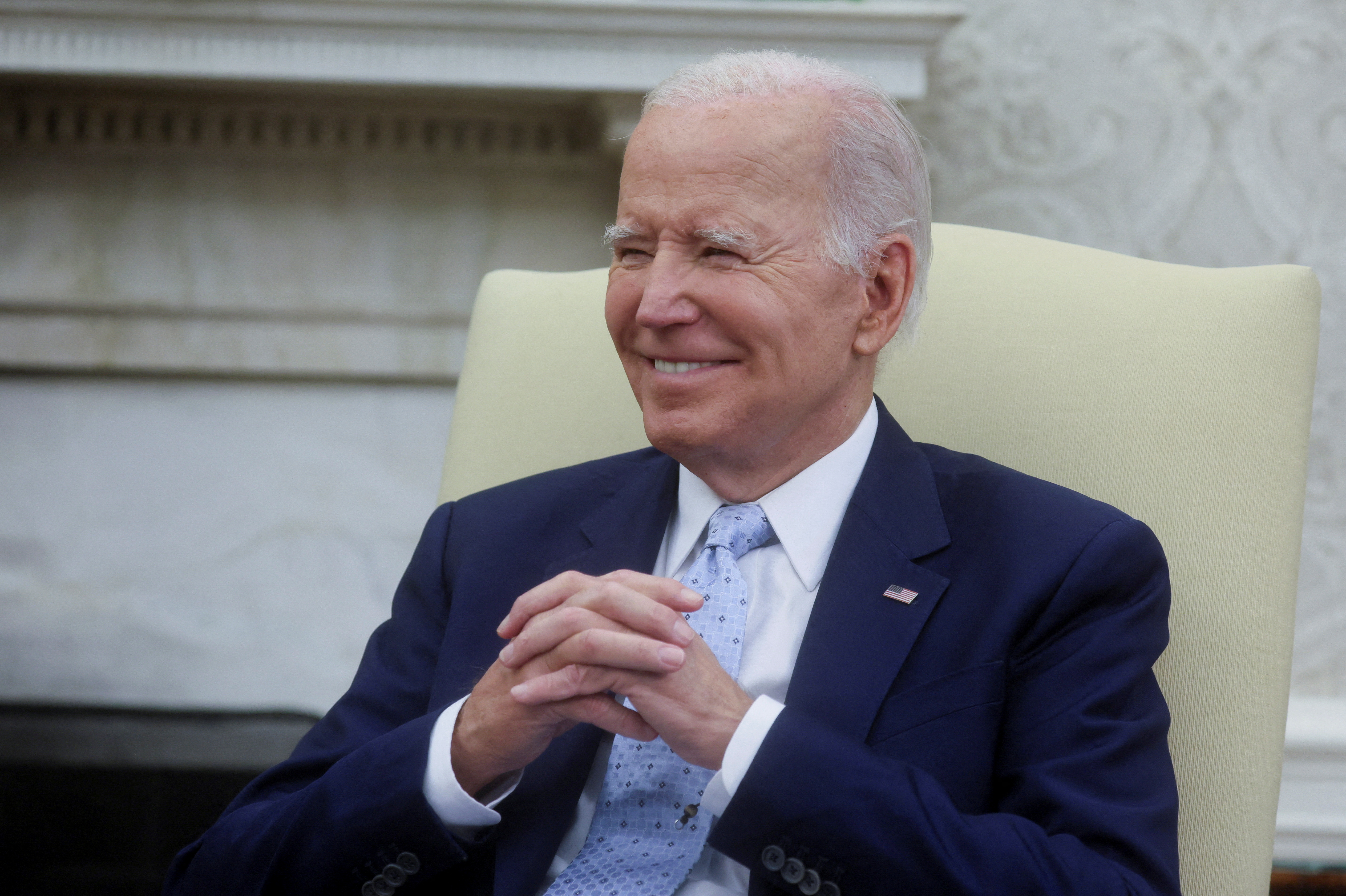 U.S. President Joe Biden reacts as he receives a briefing on Ukraine from members of his national security team in the Oval Office at the White House in Washington, U.S., October 5, 2023. 