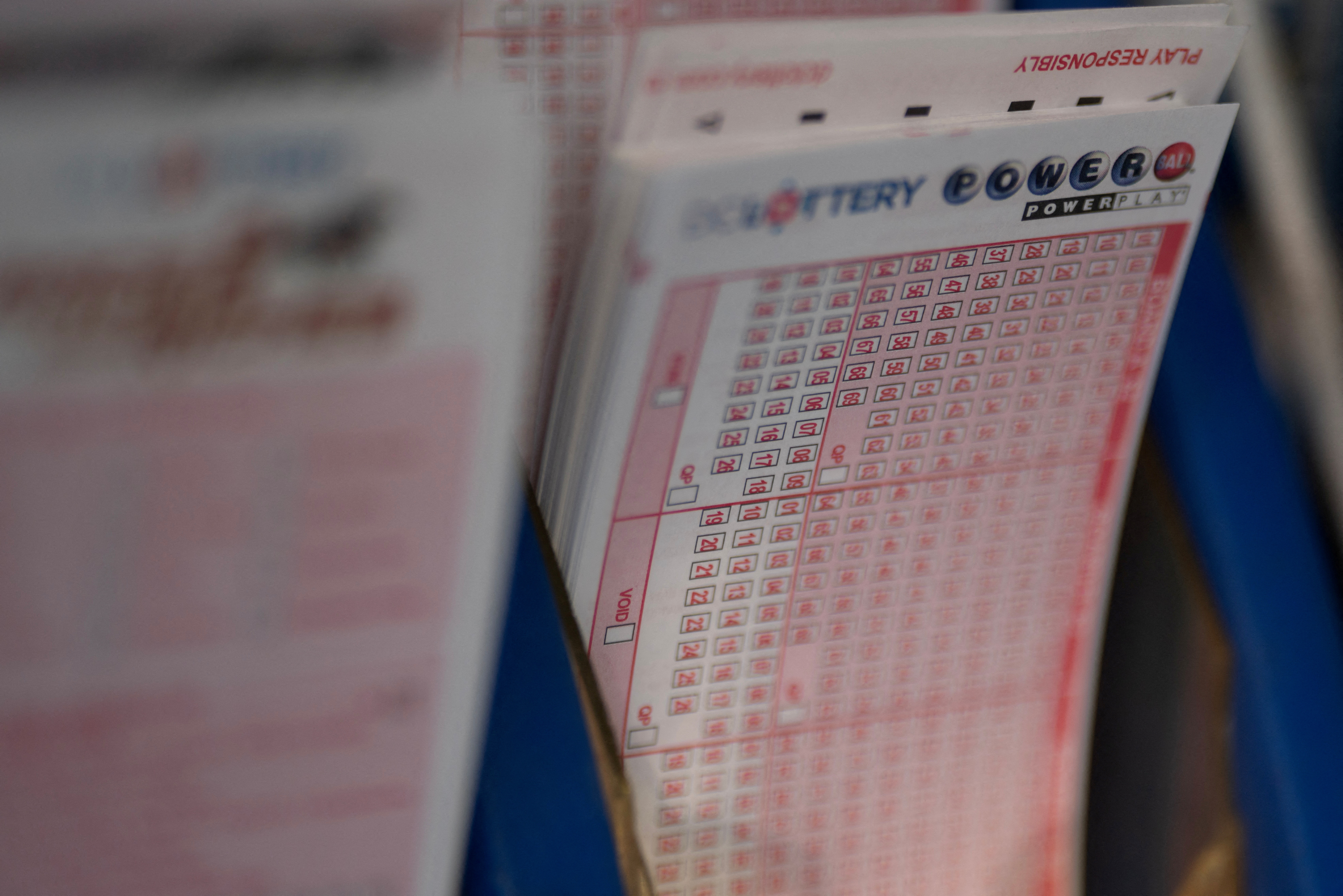 FILE PHOTO: Powerball tickets are seen at a liquor store, in Washington, U.S., July 19, 2023. REUTERS/Nathan Howard/File Photo