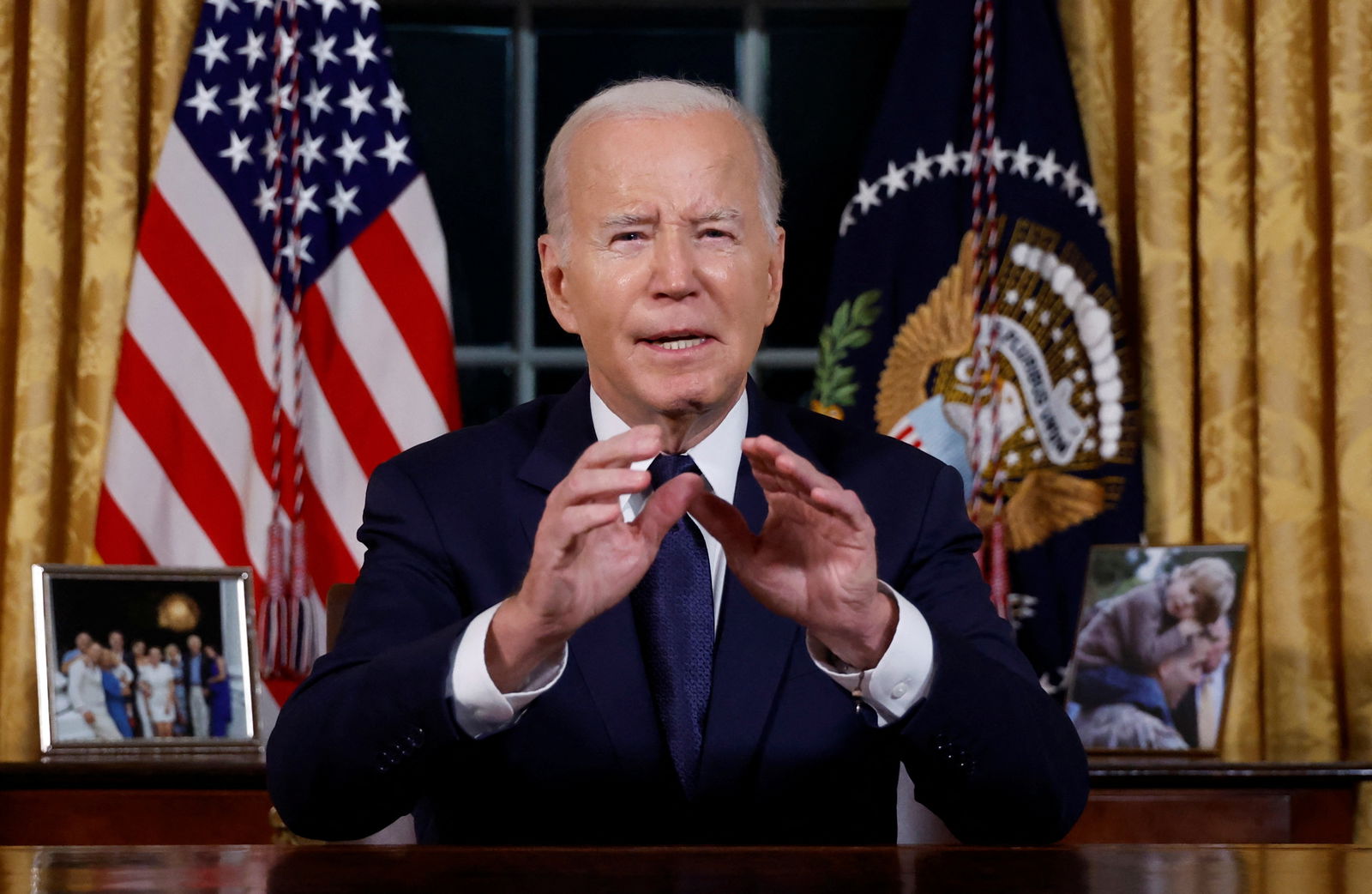 U.S. President Joe Biden delivers a prime-time address to the nation about his approaches to the conflict between Israel and Hamas, humanitarian assistance in Gaza and continued support for Ukraine in their war with Russia, from the Oval Office of the White House in Washington, U.S. October 19, 2023. 