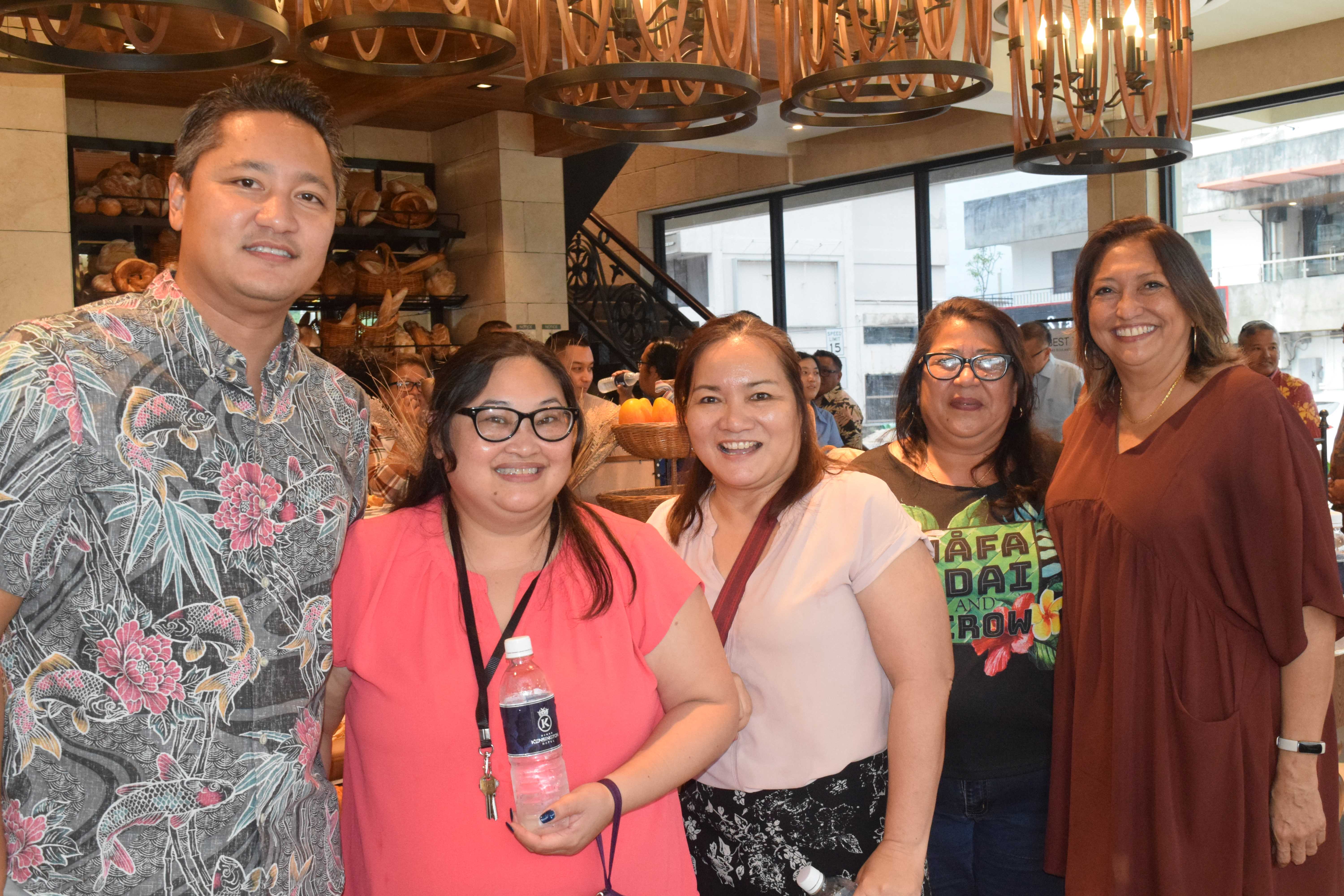 MVA Managing Director Christopher Concepcion, left, MVA Board Chairwoman Gloria Cavanagh and MVA staff.