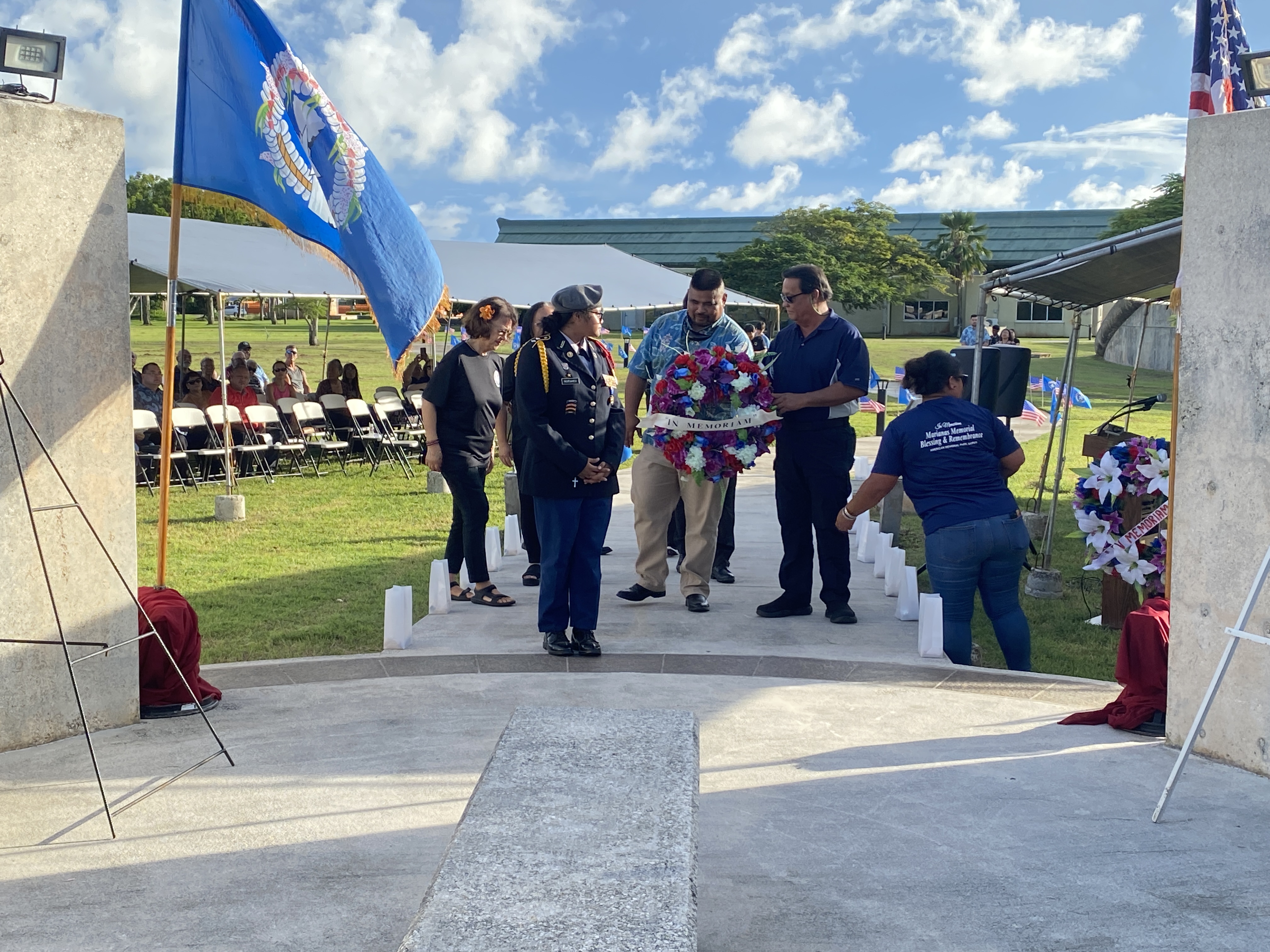 Northern Islands Mayor Valentine Taisacan, left, and Saipan Mayor RB Camacho, right, approach the Marianas Memorial Courtyard to lay a wreath. 