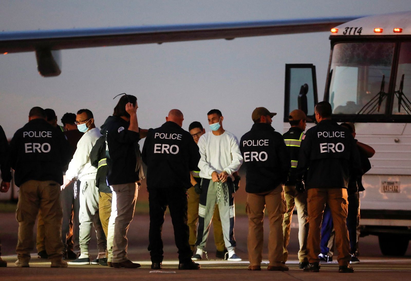 Venezuelan migrants are pat-down before boarding a repatriation flight as a part of an immigration enforcement process, at the Valley International Airport, in Harlingen, Texas, U.S. October 18, 2023. 