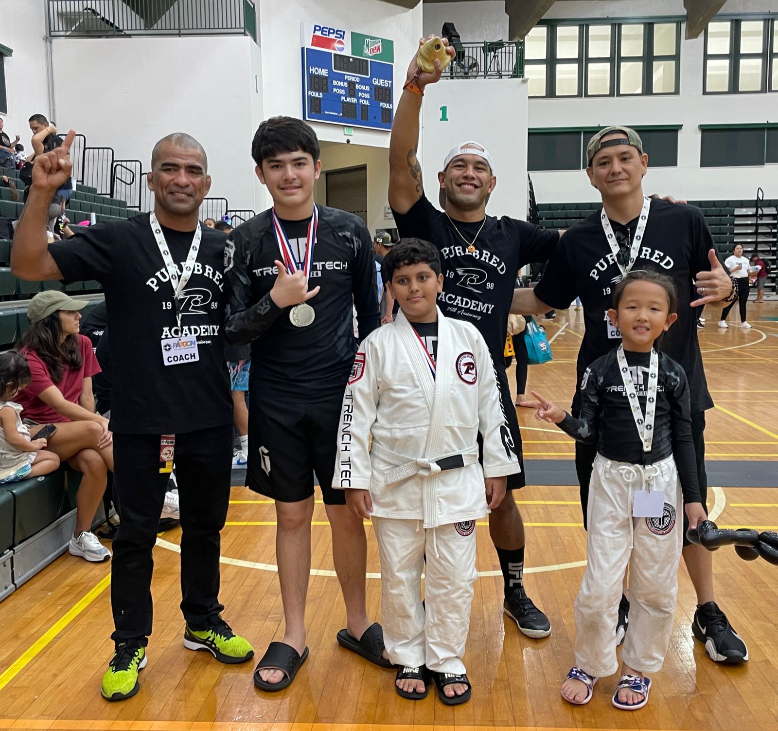 Saipan's youngest fighter, Sophia Choi, right, with her Trench Tech Purebred Saipan family: Cuki Alvarez, Gabriel Mitchel, Mateo Almada Frank Camacho and Ken Tanzawa.