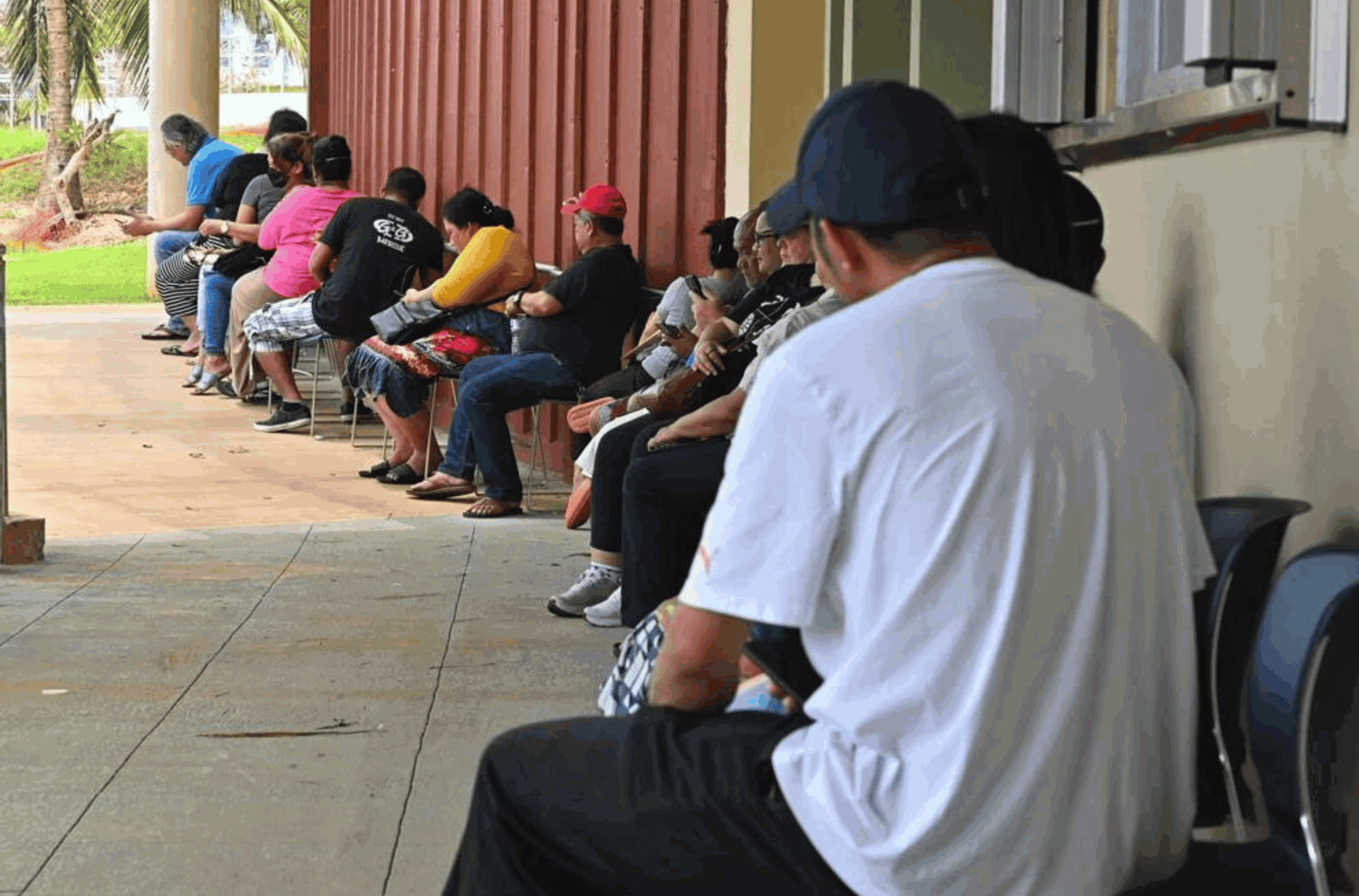 People wait in line at the FEMA Disaster Recovery Center Sunday June 4, 2023, at the Guam Community College in Mangilao.