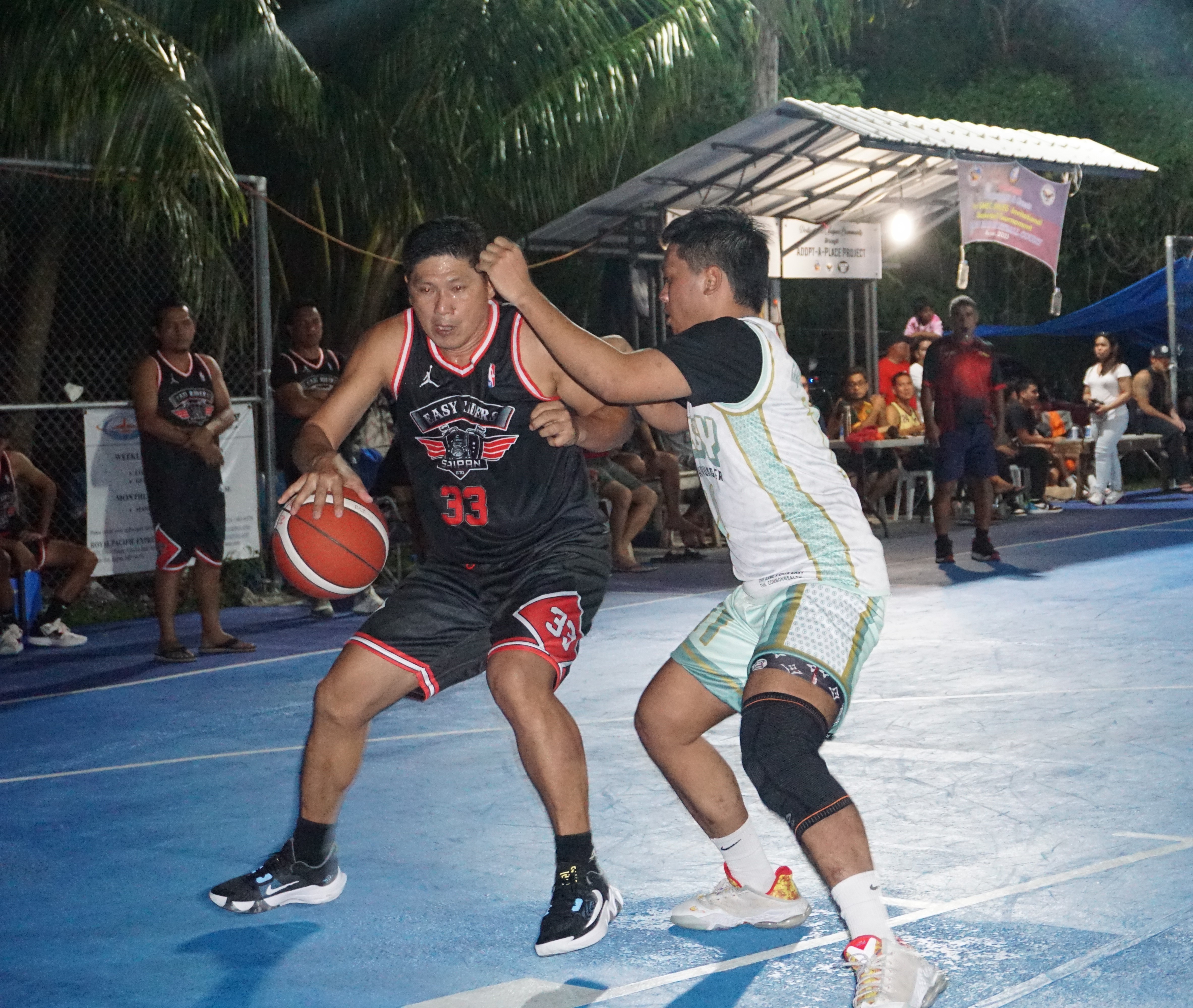 Easy Riders' Jorge De Guzman posts against a defender during a semifinal game of the 2023 Saipan Magalahi Eagles Club Invitational Basketball League at the Gualo Rai basketball court on Saturday.