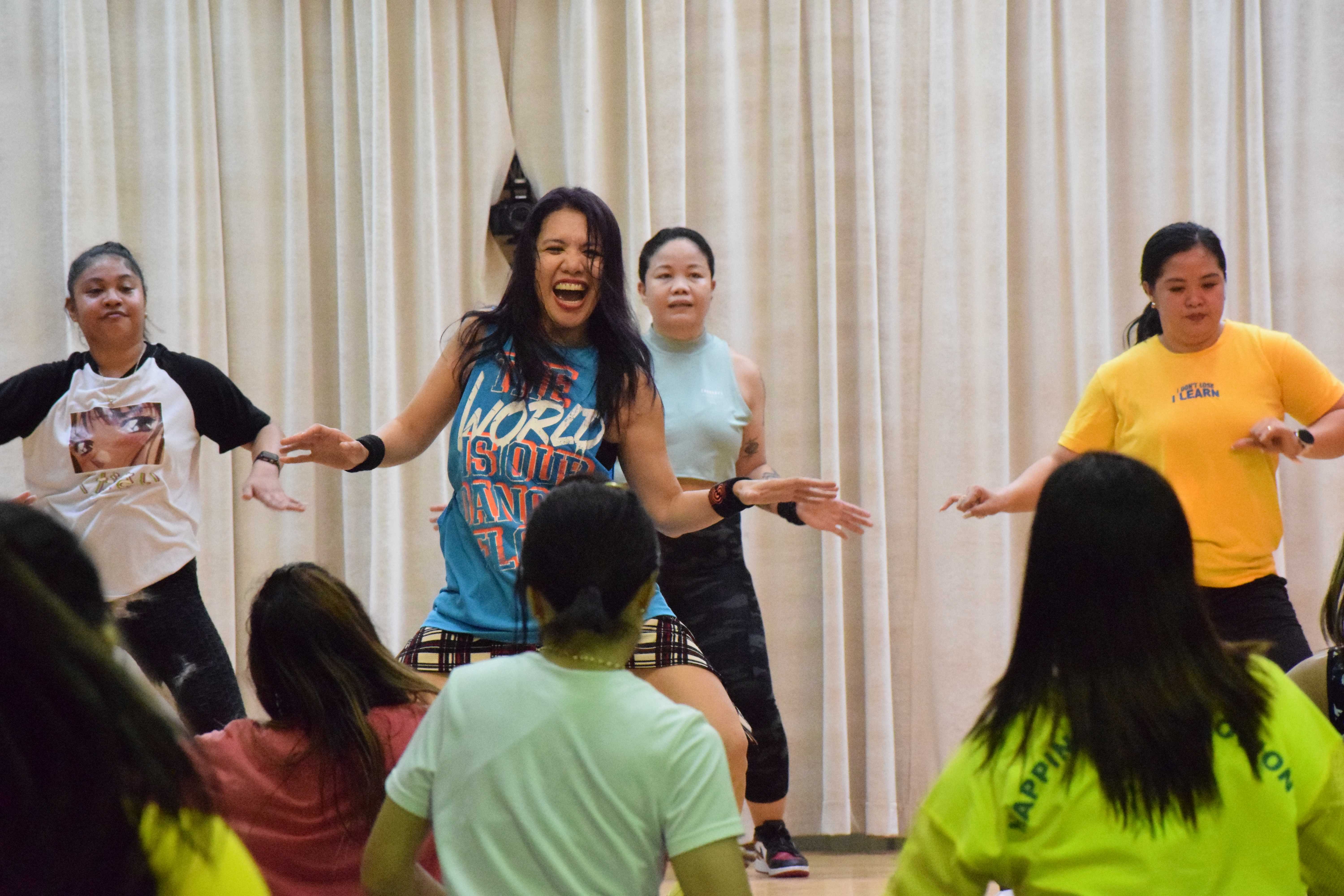 Instructor Shellan Sarmiento leads a Zumba dance routine at the multi-purpose center on Saturday.