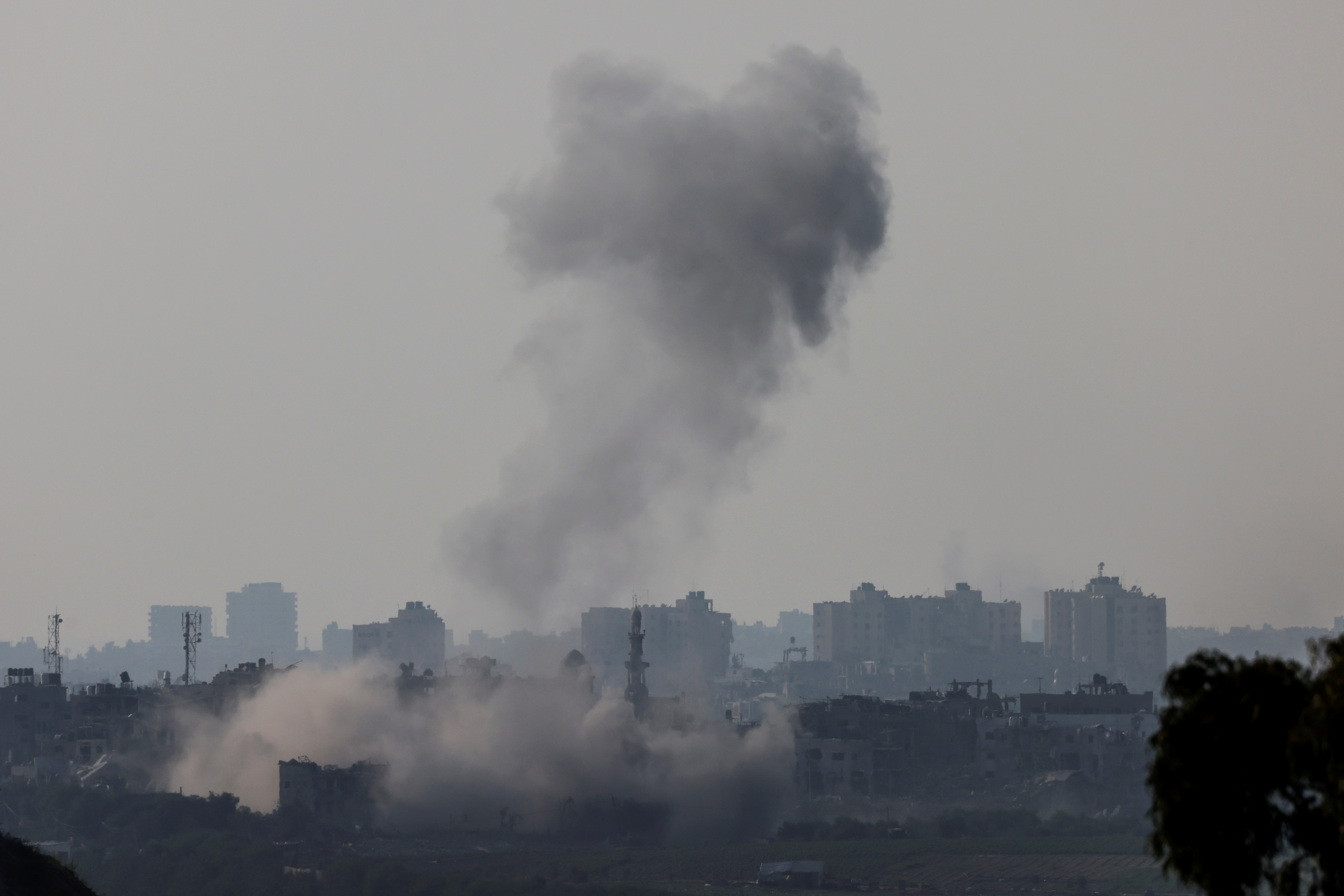 Smoke is seen rising in Gaza from a viewpoint in Southern Israel October 23, 2023. 