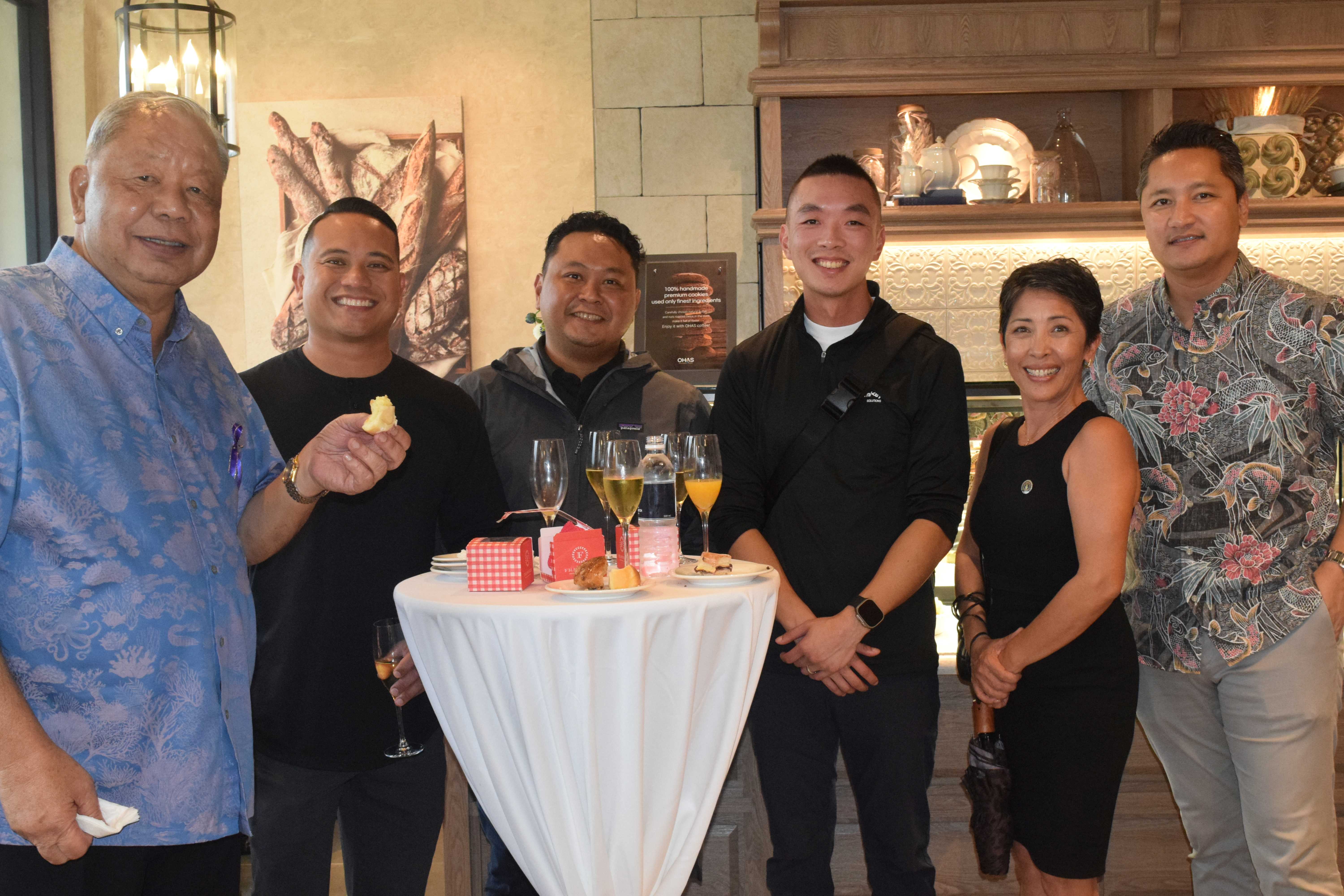 Lt. Gov. David M. Apatang left, Rep. Marissa Flores, second right, and Marianas Visitors Authority Managing Director Christopher Concepcion, right, and other guests.
