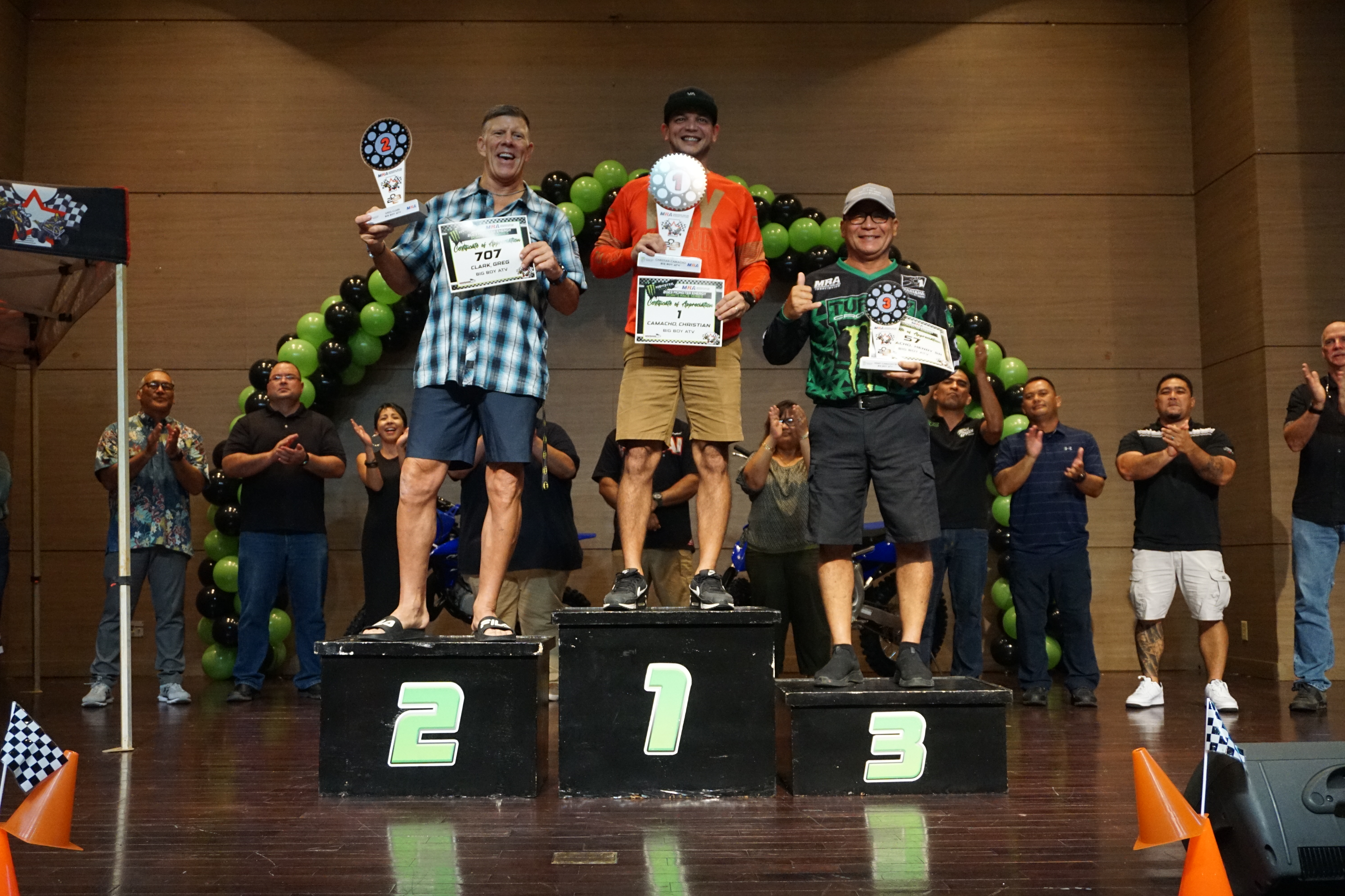 Christian Camacho, center, with Greg Clack, left, and Henry Camacho hold their trophies in the ATV Class during the 2023 MRA Monster Energy Points Race Series awards ceremony on Saturday, Sept. 30, at the Saipan World Resort Taga Hall.