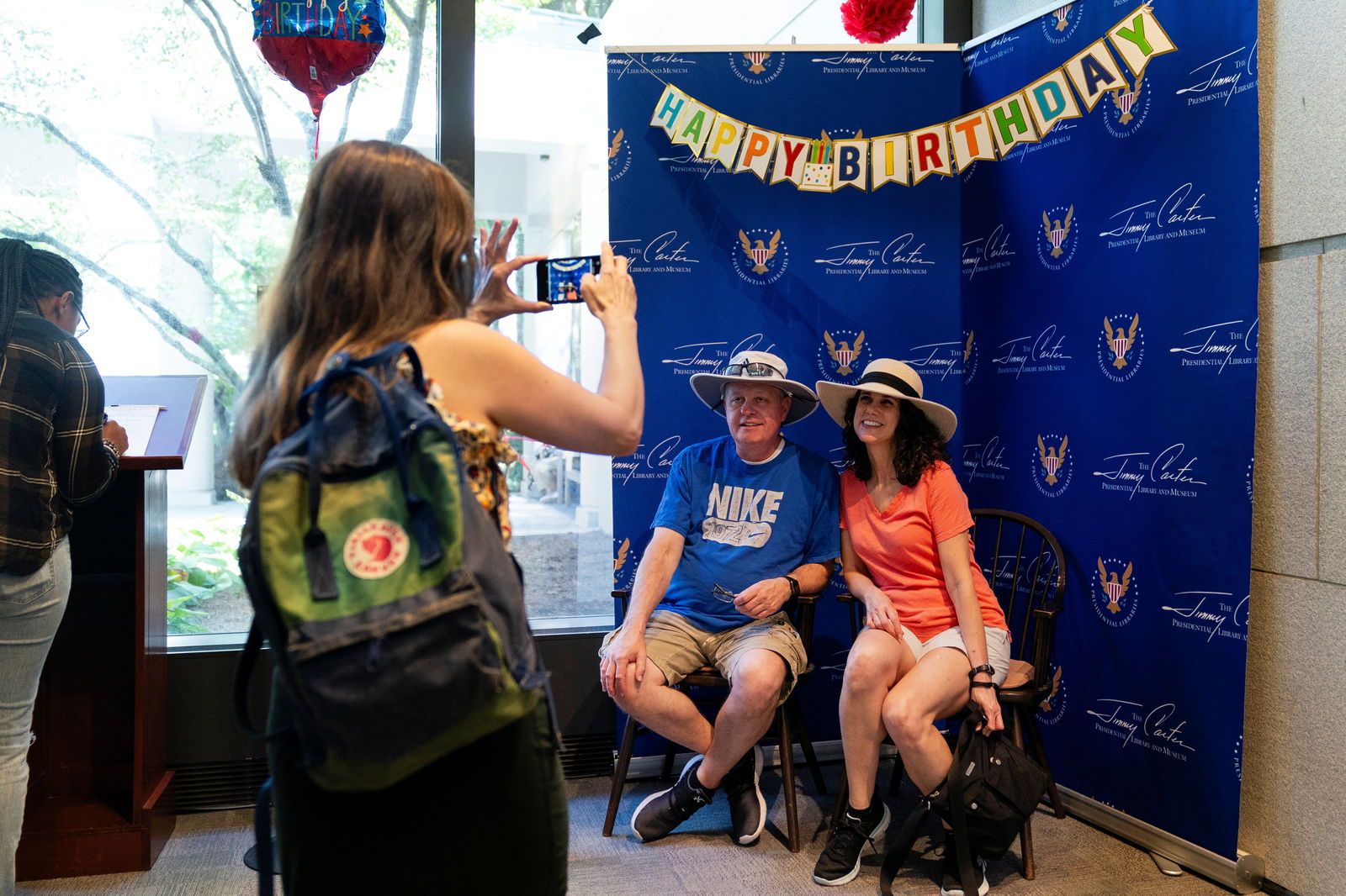 Visotors pose for a photo at a public birthday party held a day before former U.S. President Jimmy Carter turns 99 years old, at the Jimmy Carter Presidential Library and Museum in Atlanta, Georgia, U.S. September 30, 2023. 