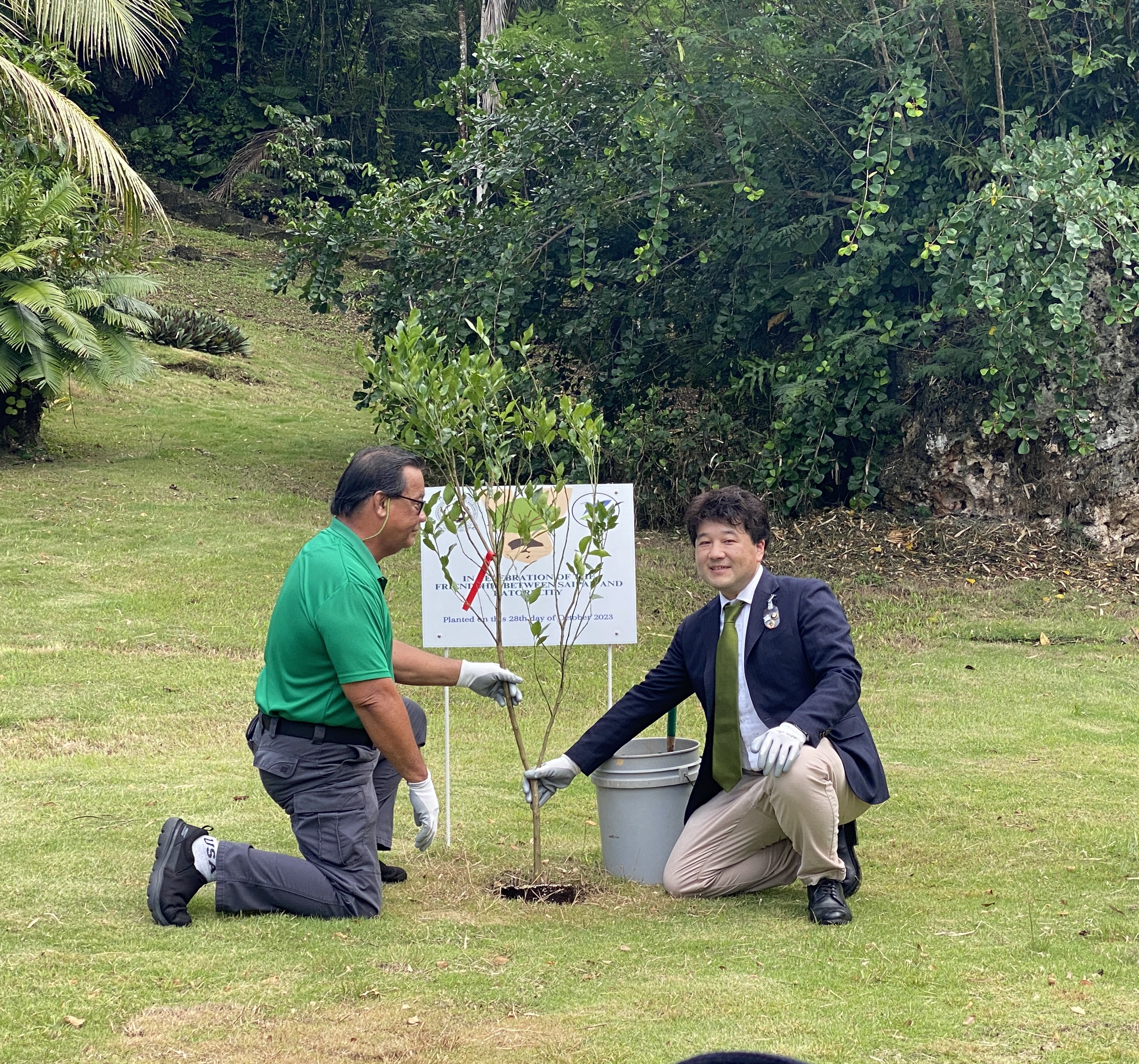Saipan Mayor RB Camacho and Katori Mayor Tomonori Ito of Japan plant a tangerine tree at Sugar King Park on Saturday, Oct. 28, 2023.