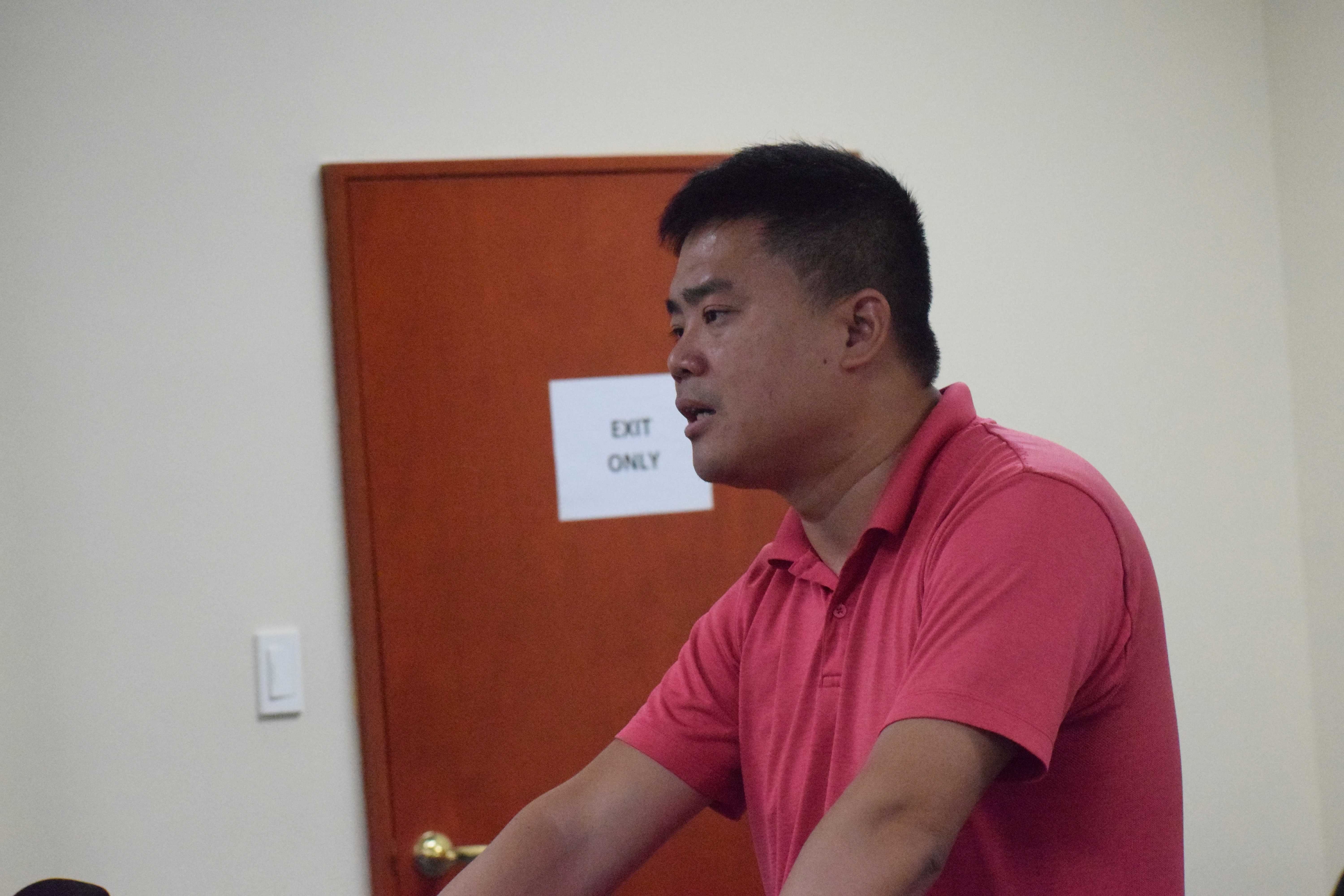 Imperial Pacific International Director How Yo Chi answers a question from the Commonwealth Casino Commission during a meeting on Thursday at the CCC office in Gualo Rai.