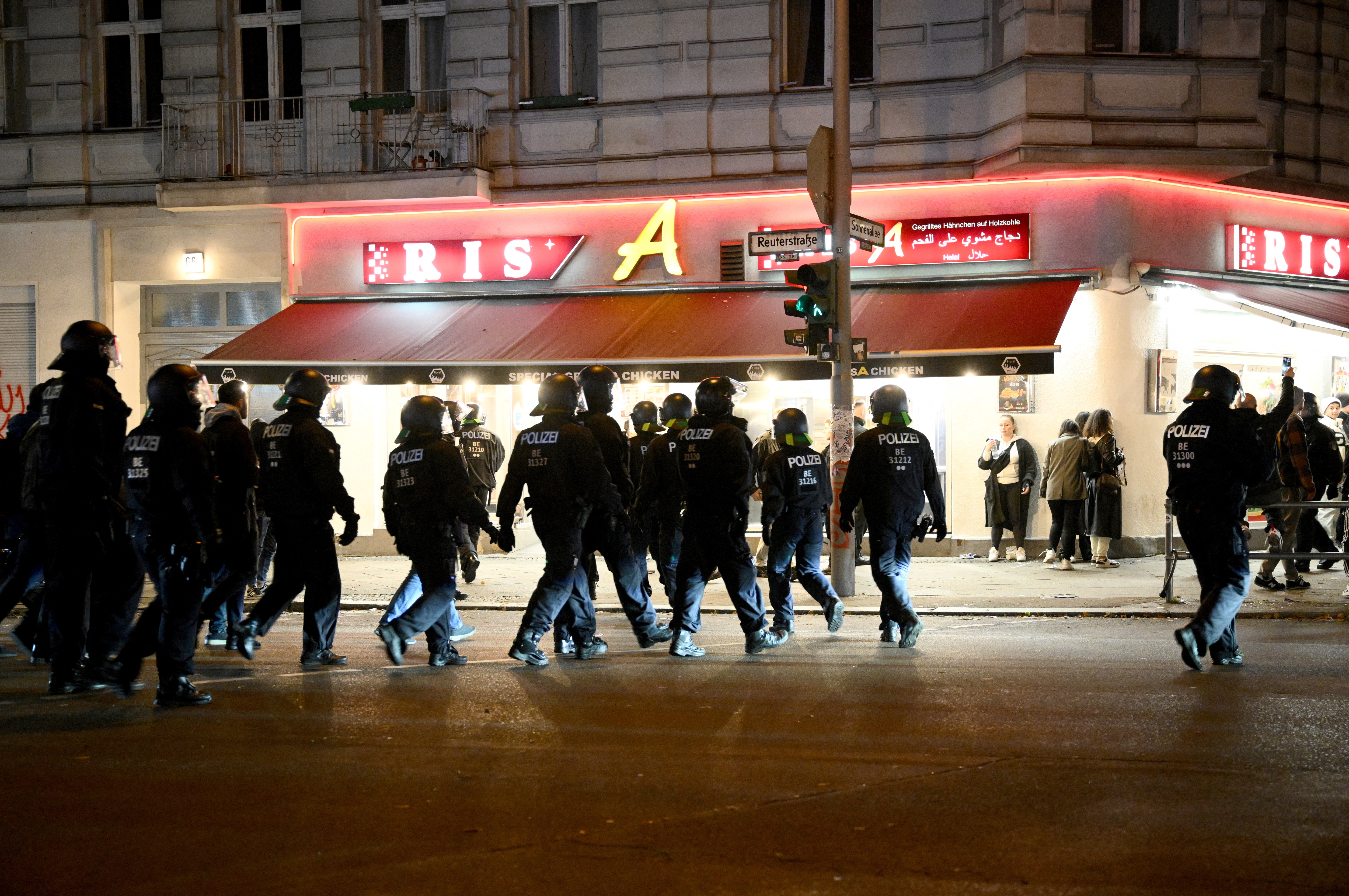 Police officers walk the street at the Neukoelln district, in expectation of a pro-Palestinian protest, amid the ongoing conflict between Israel and the Palestinian group Hamas, in Berlin, Germany, October 21, 2023. 
