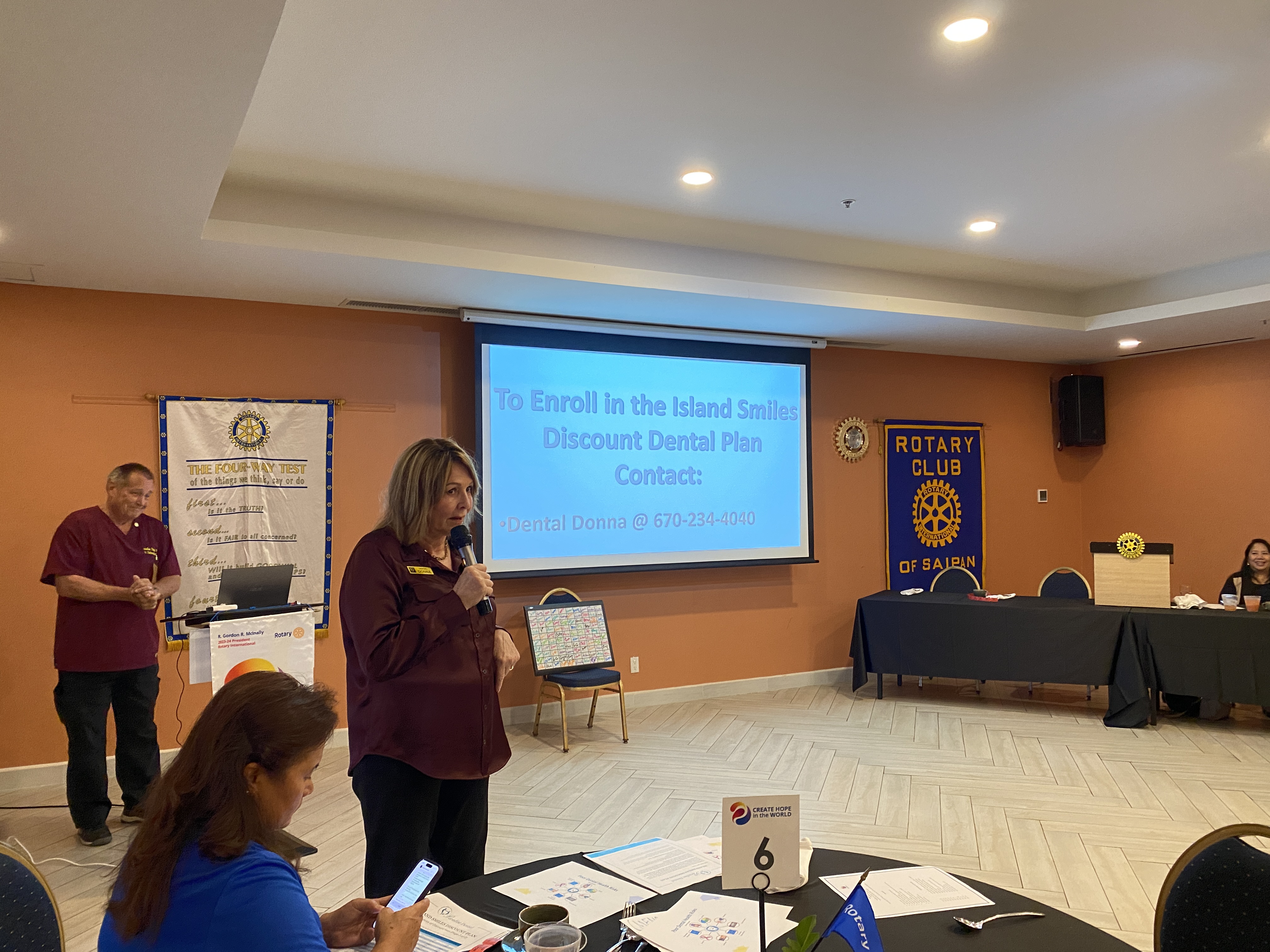 Donna Krum, president of Paradise Dental Spa, makes a presentation at the Rotary Club of Saipan's general meeting on Oct. 17 at Crowne Plaza. Behind her is her husband, Dr. Nelson Krum.