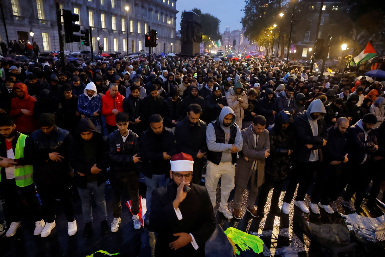 Demonstrators participate in Muslim prayers during a vigil outside Downing Street in solidarity with Palestinians after the Al-Ahli hospital blast in Gaza, amid the ongoing conflict between Israel and the Palestinian Islamist group Hamas, in London, Britain, October 18, 2023. 