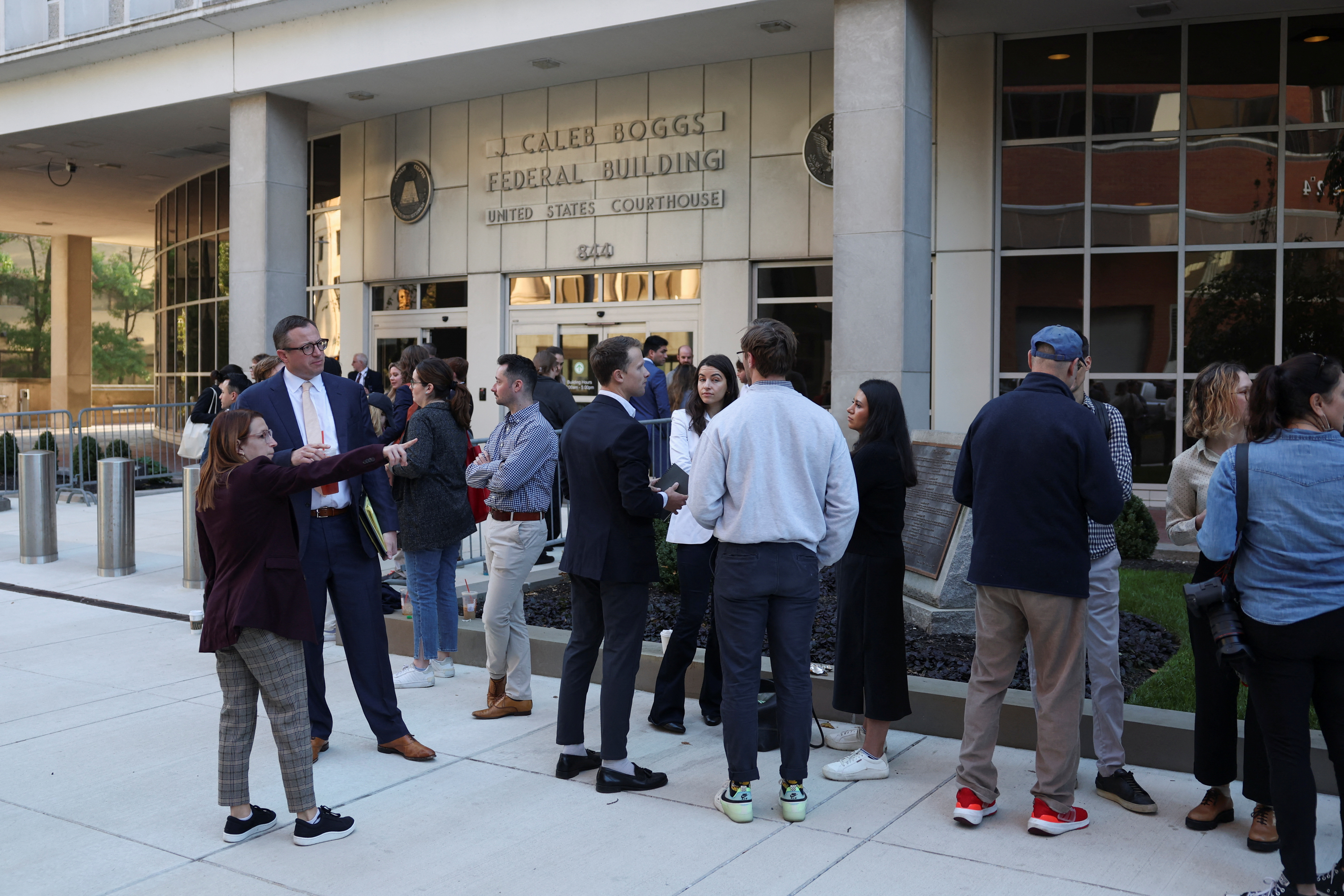 Members of the media wait outside, as U.S. President Joe Biden's son, Hunter Biden is to appear in a federal court on gun charges in Wilmington, Delaware, U.S., October 3, 2023.  