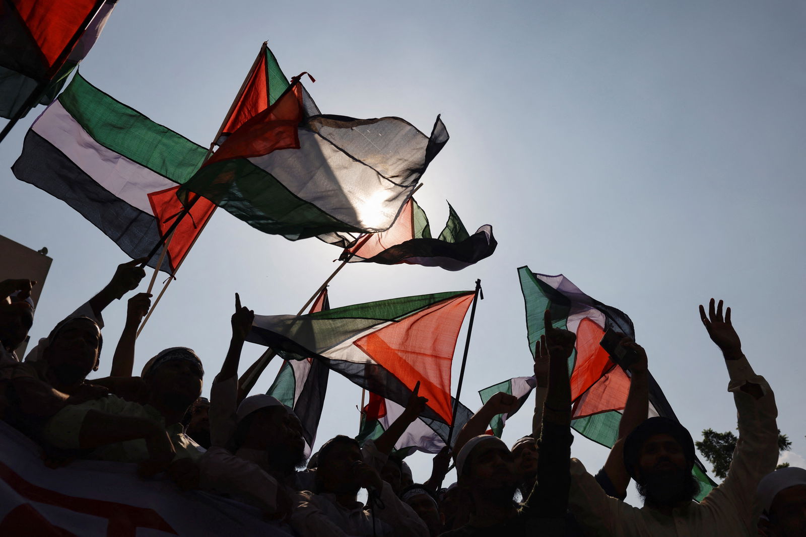 Bangladeshi Muslim activists wave Palestinian flags as they protest against Israel's actions against Palestinians after Friday prayer at the Baitul Mukarram National Mosque in Dhaka, Bangladesh, October 13, 2023. REUTERS/Mohammad Ponir Hossain