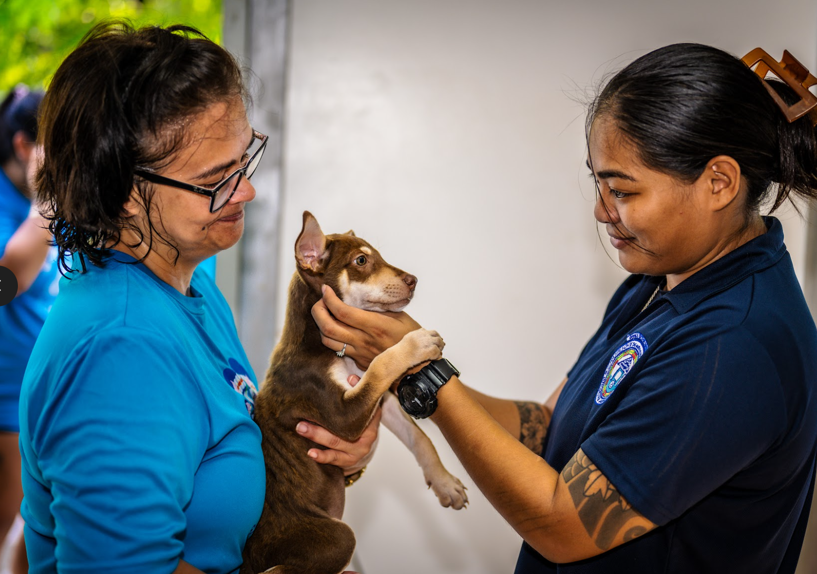 Saipan Humane Society board member Dorsha Moreno and Dog Control staff Stephanie Camacho check in a patient