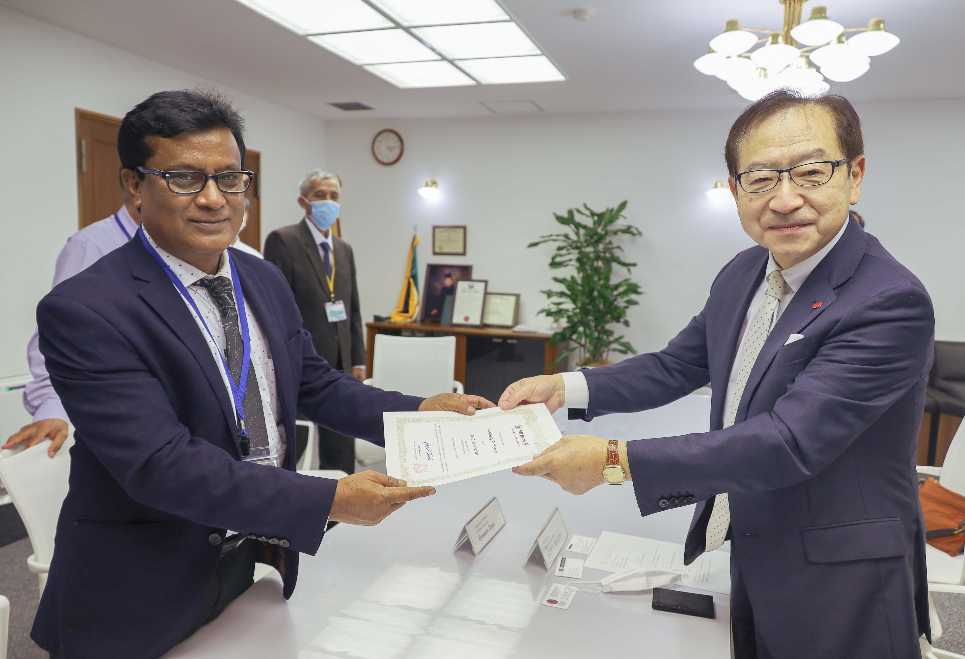 CNMI Food Science Program Leader and Professor Dr. Zaidul Sarker of Northern Marianas College’s Cooperative Research, Extension with Education Services with Fukuoka University President Keijiro Saku.