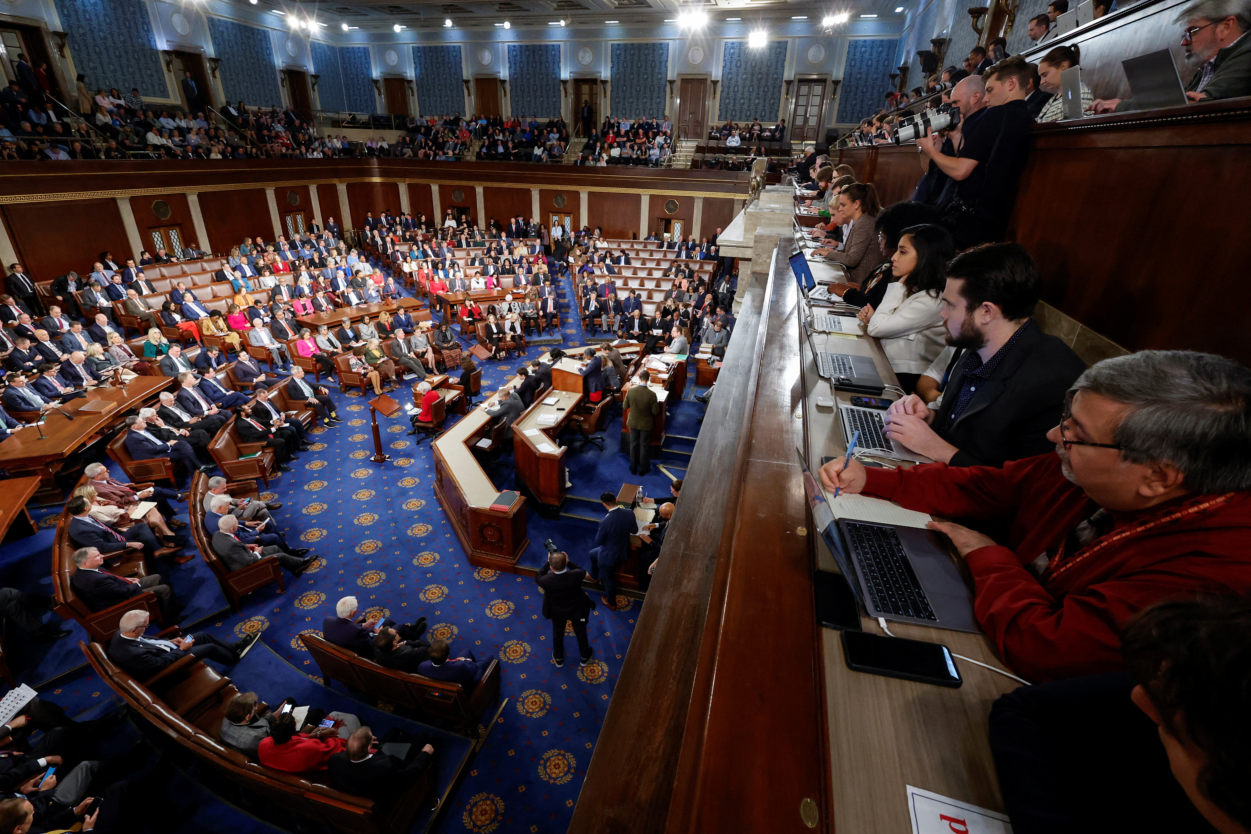 Members of the Capitol Hill press corps keep watch as the U.S. House of Representatives gathers for a third round of voting to elect a new Speaker of the House at the U.S. Capitol in Washington, U.S., October 20, 2023. 