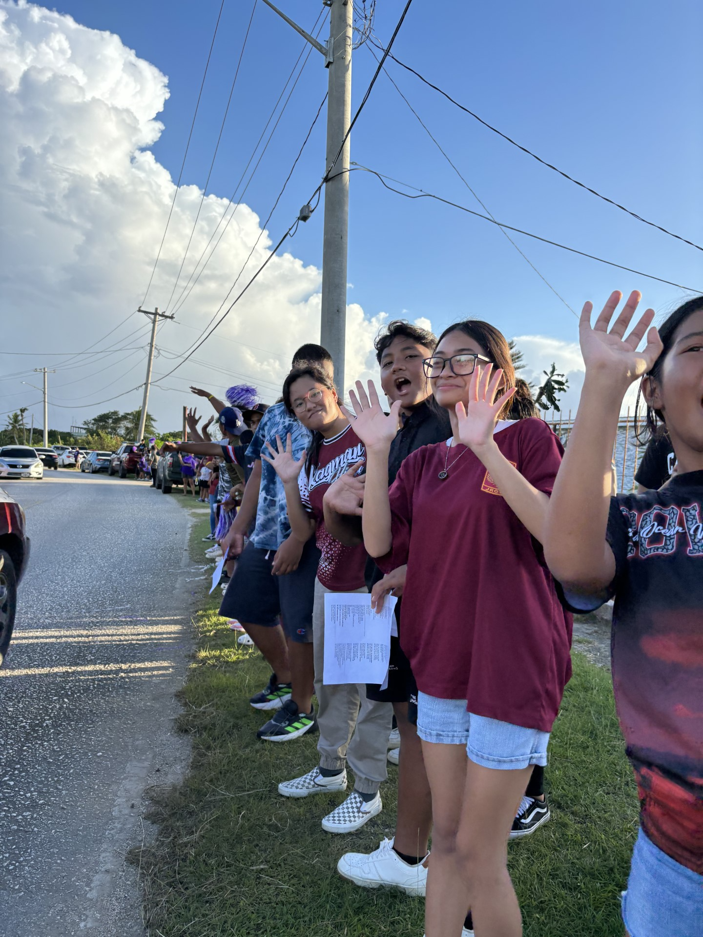 The Ayuyu Battalion cadets participate in a roadside waving activity.