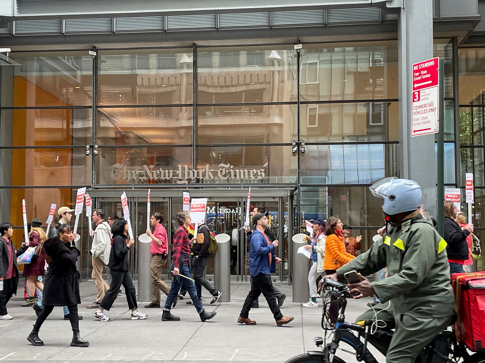 New York Times technology union members walk the picket line outside the company's headquarters, in New York City, U.S., October 30, 2023. 