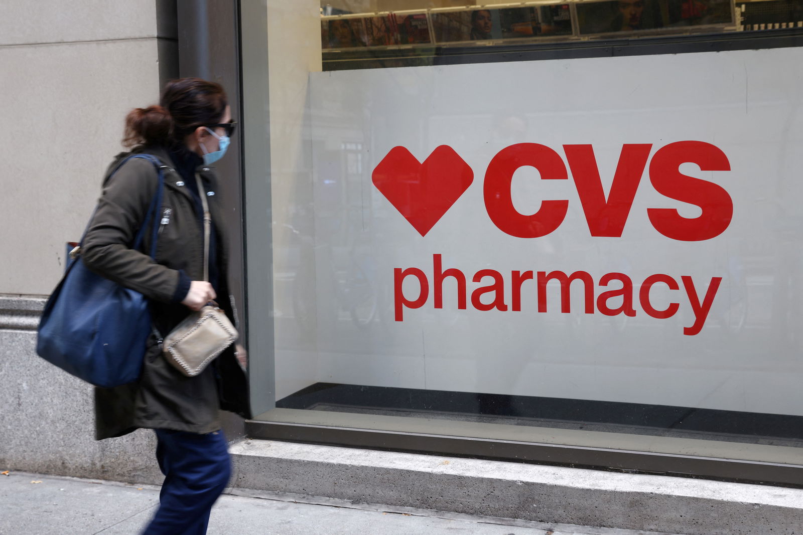 A person walks by a CVS pharmacy store in Manhattan, New York, U.S., November 15, 2021. 