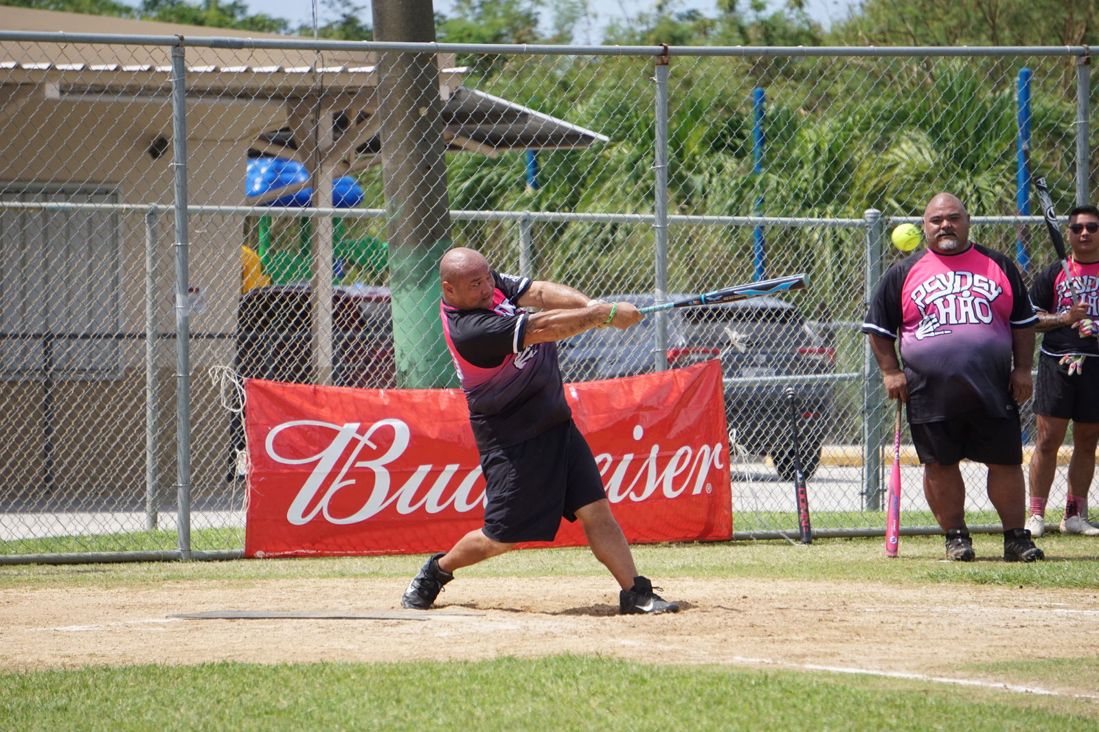 Payday Hao's Rob Bansil connects the line drive during a playoff game of the 2023 Belau Amateur Softball Association Open League at the Dandan baseball field on Sunday.