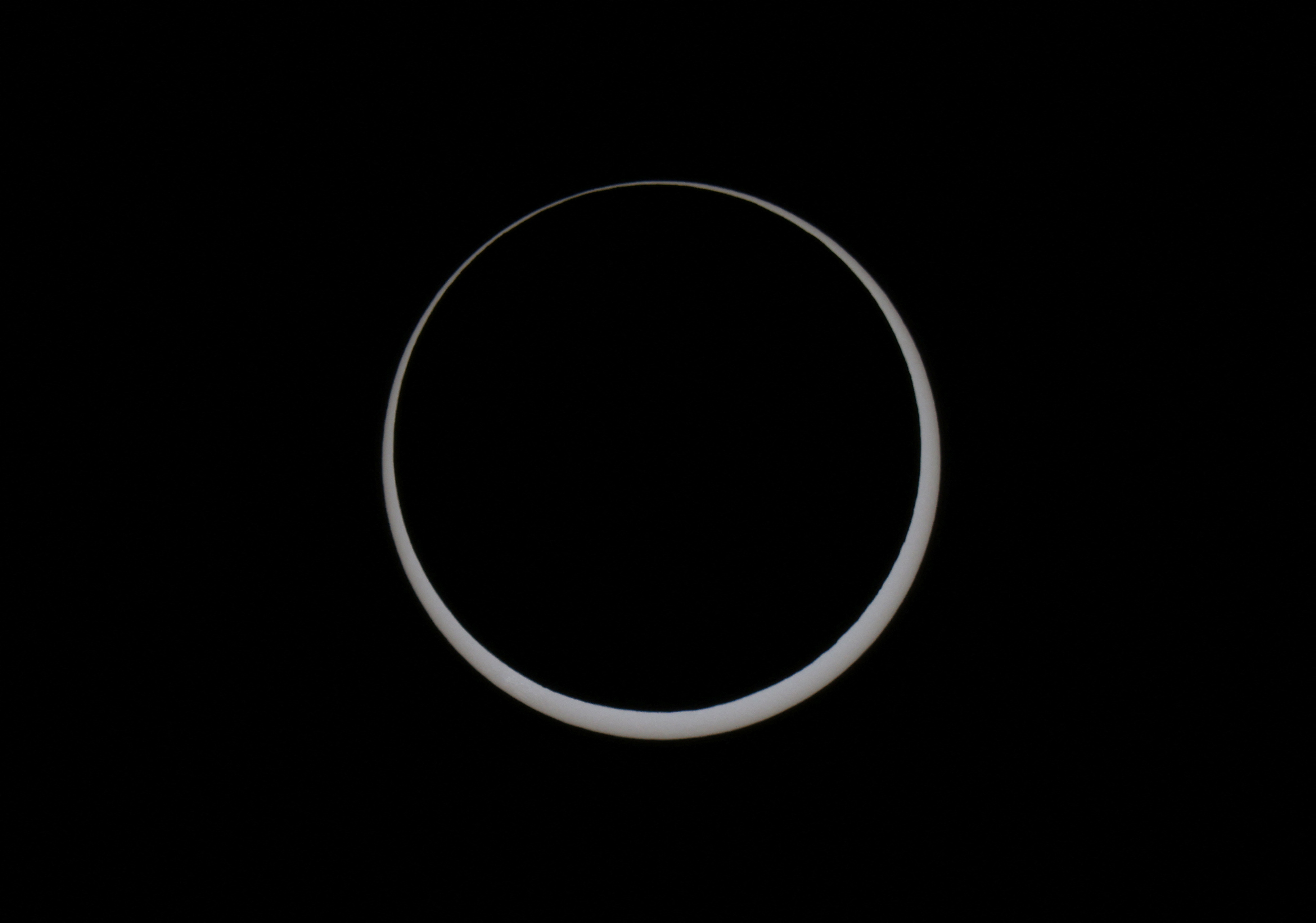 The moon obscures the sun as people gather in Monument Valley to watch the annular solar eclipse in the Navajo Nation, Arizona, U.S., October 14, 2023. REUTERS/Jim Urquhart