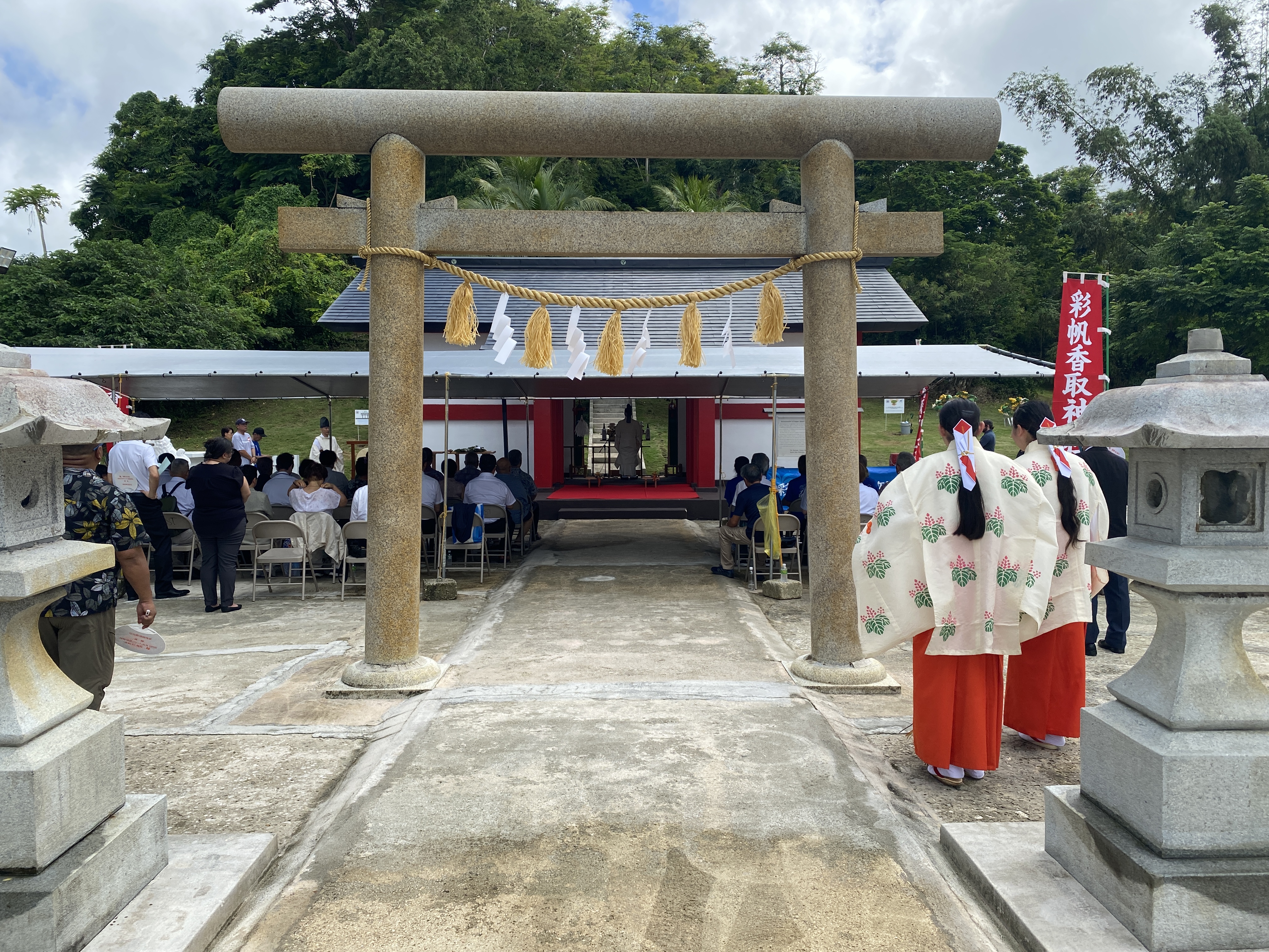Two Katori Shrine members await the start of the Shinto ceremony at the Saipan Katori Shrine in Garapan in 2023.