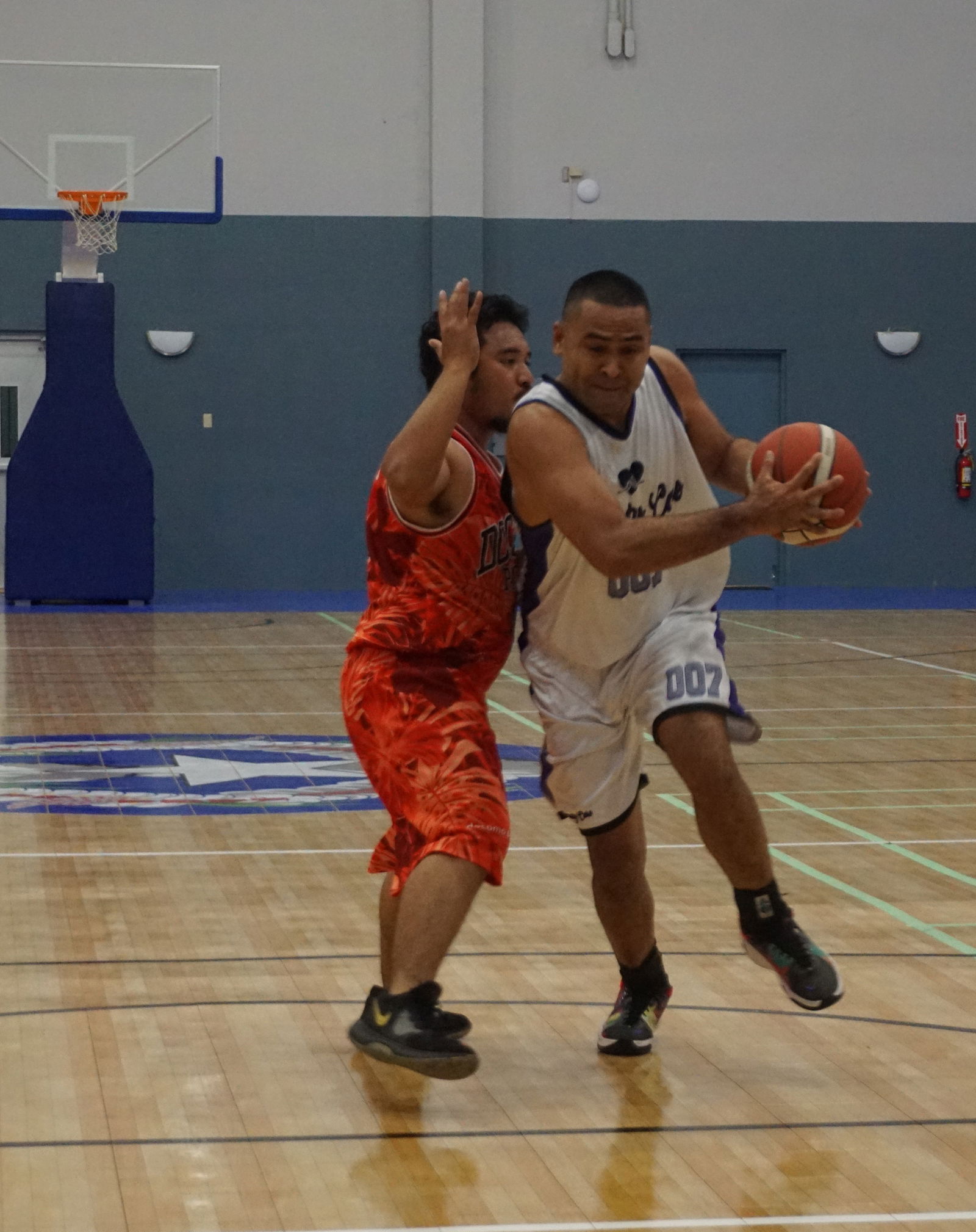 Priority Care's Marvin Rabauliman makes contact with a defender as he attempts to drive in during a game against Docomo in the 2023 R&J Wine and Liquor Inter-Government/Business League at the Ada gym on Saturday.