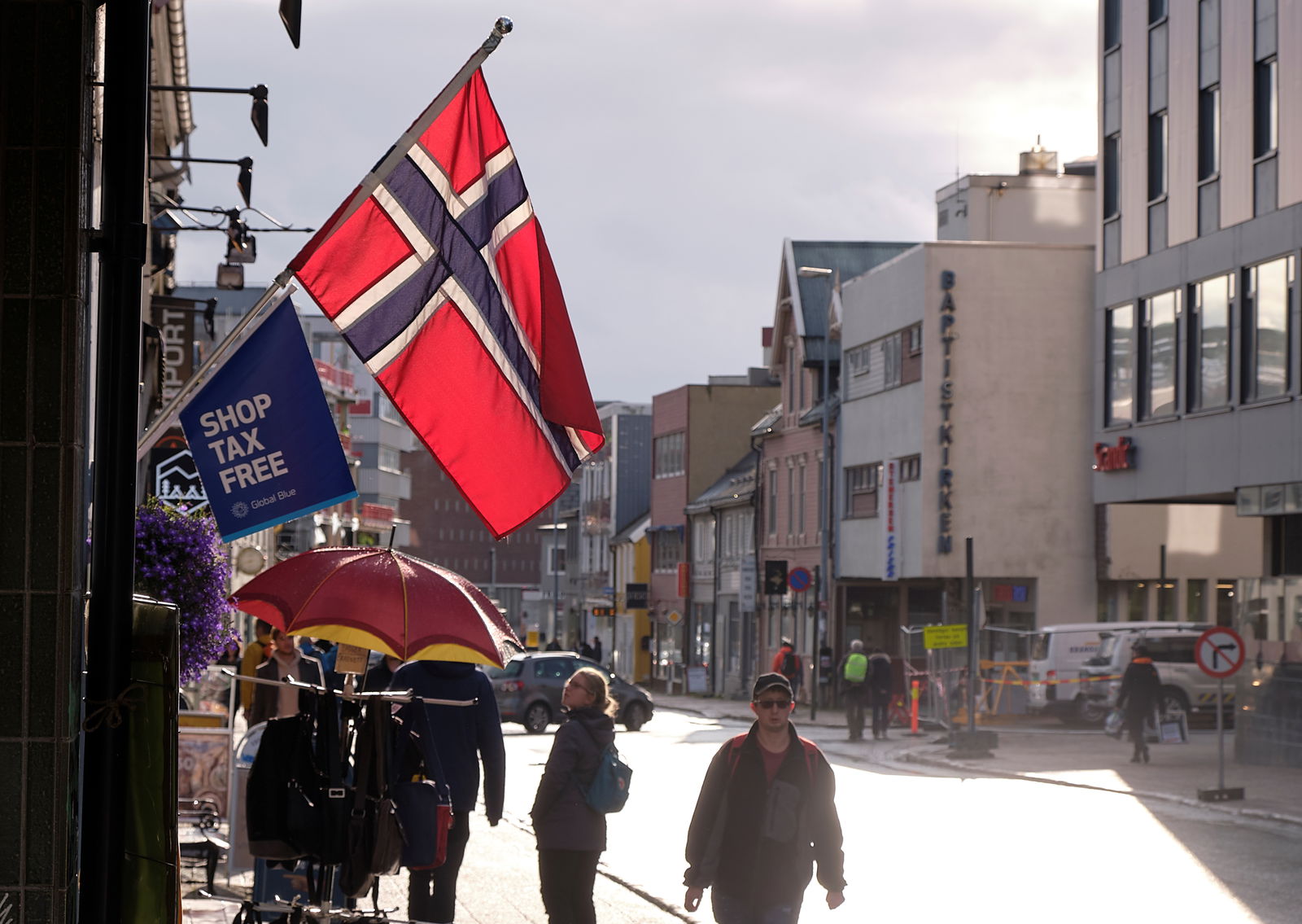 A Norwegian flag flutters over a shop in Tromso, Norway September 19, 2019. 