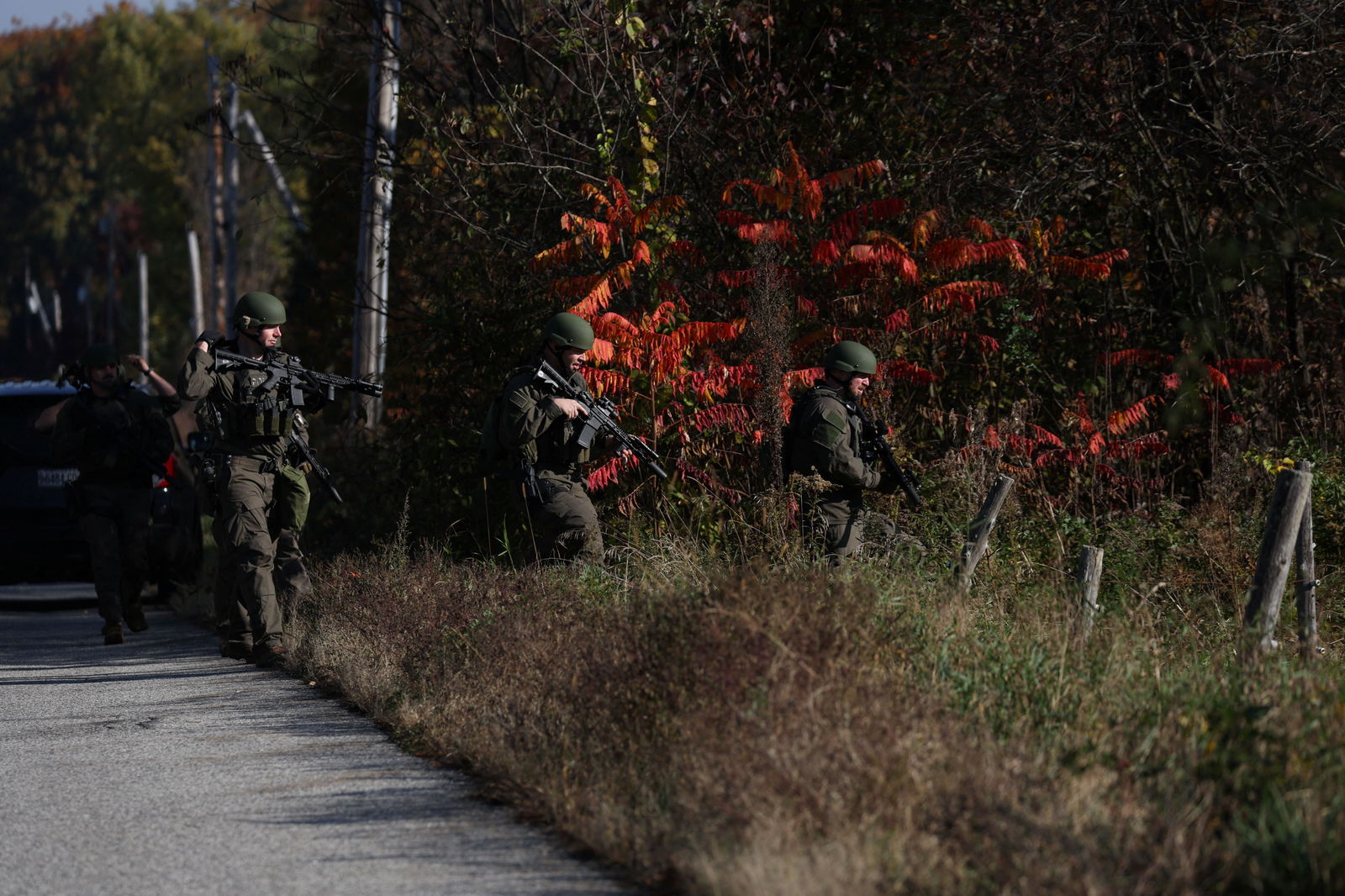 Members of law enforcement work as the search for the suspect in the deadly mass shootings in Lewiston continues in Monmouth, Maine, U.S., October 27, 2023. 
