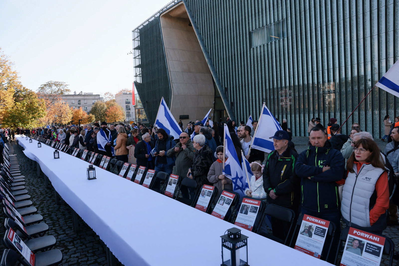 People take part in a gathering in solidarity with victims of the Hamas attack on Israel, amid the ongoing fighting between Israel and the Palestinian Islamist group Hamas, next to the Museum of the History of Polish Jews and the Monument to the Ghetto Heroes in Warsaw, Poland, October 29, 2023. 