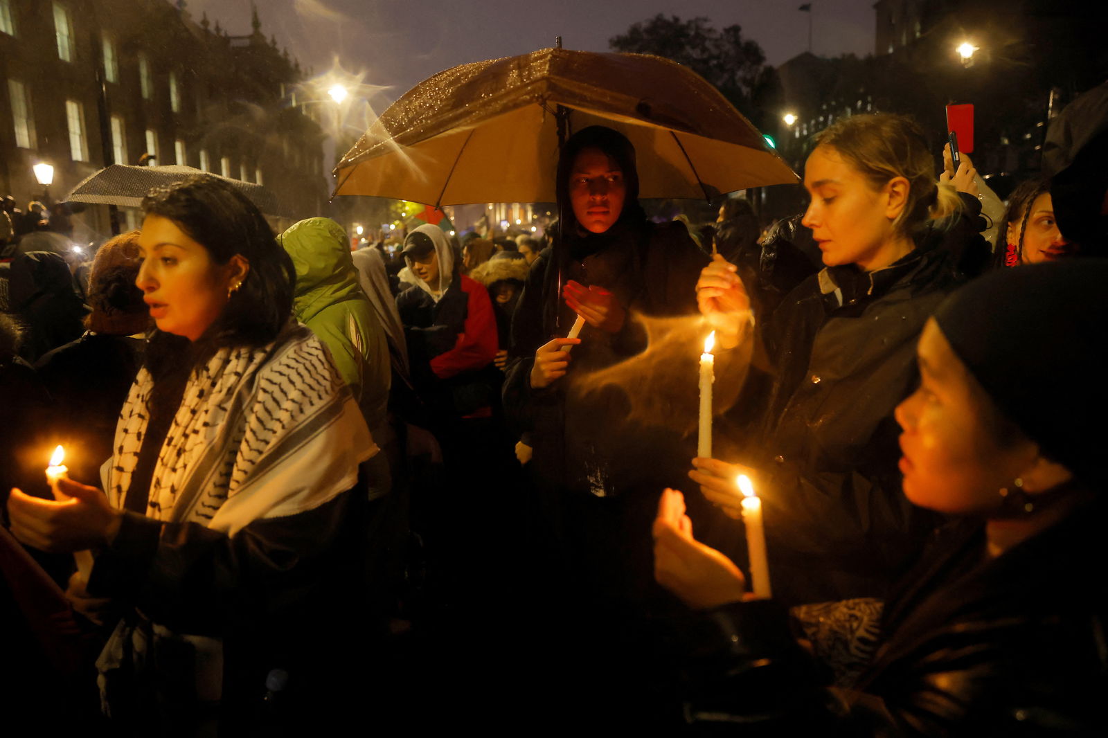 Demonstrators hold a vigil outside Downing Street in solidarity with Palestinians after the Al-Ahli hospital blast in Gaza, amid the ongoing conflict between Israel and the Palestinian Islamist group Hamas, in London, Britain, October 18, 2023. 