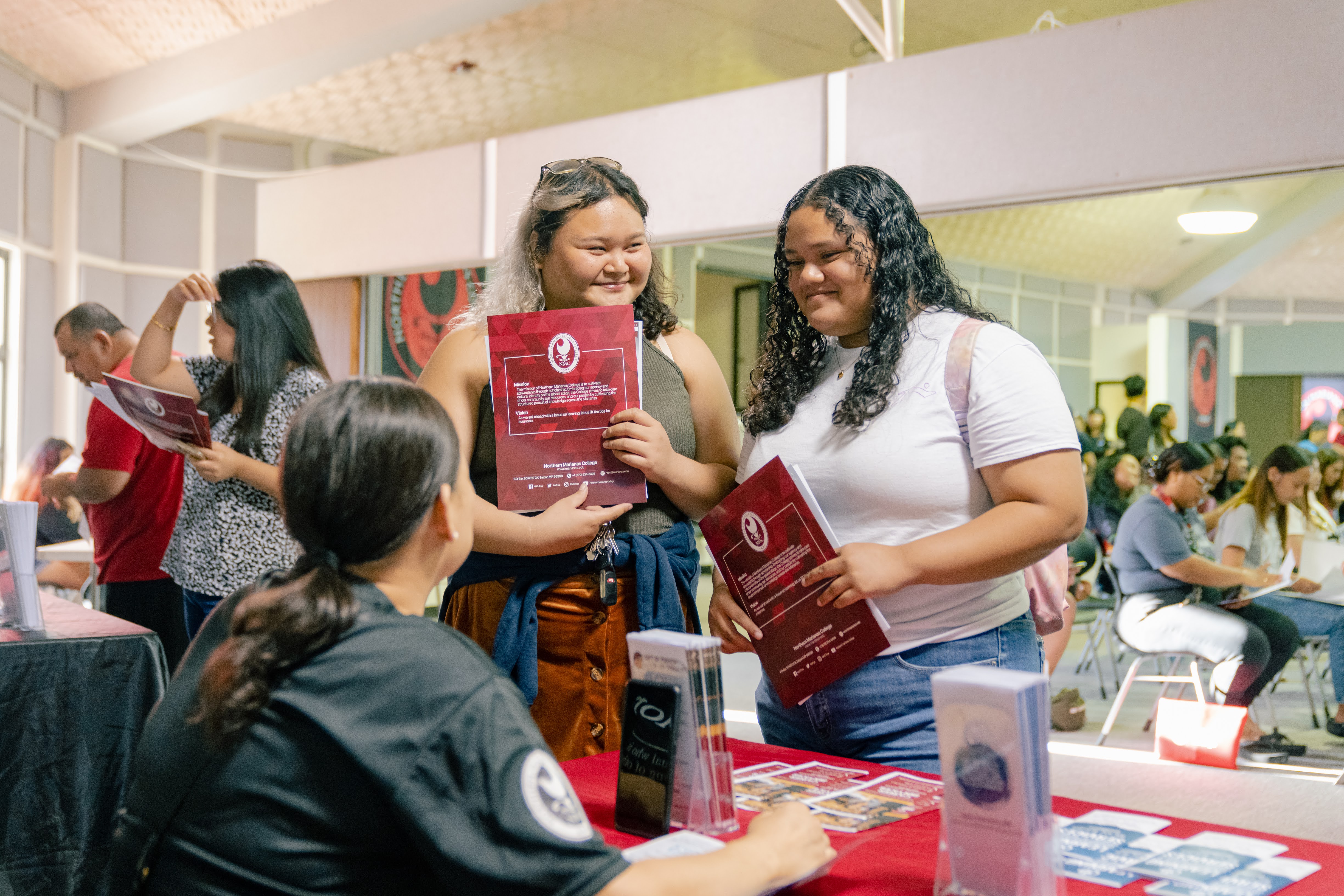 Participants of the last info session held by Northern Marianas College speak with a college representative. NMC will host another free info session on Oct. 25, 2023 at the Governor Pedro P. Tenorio Multi-Purpose Center.