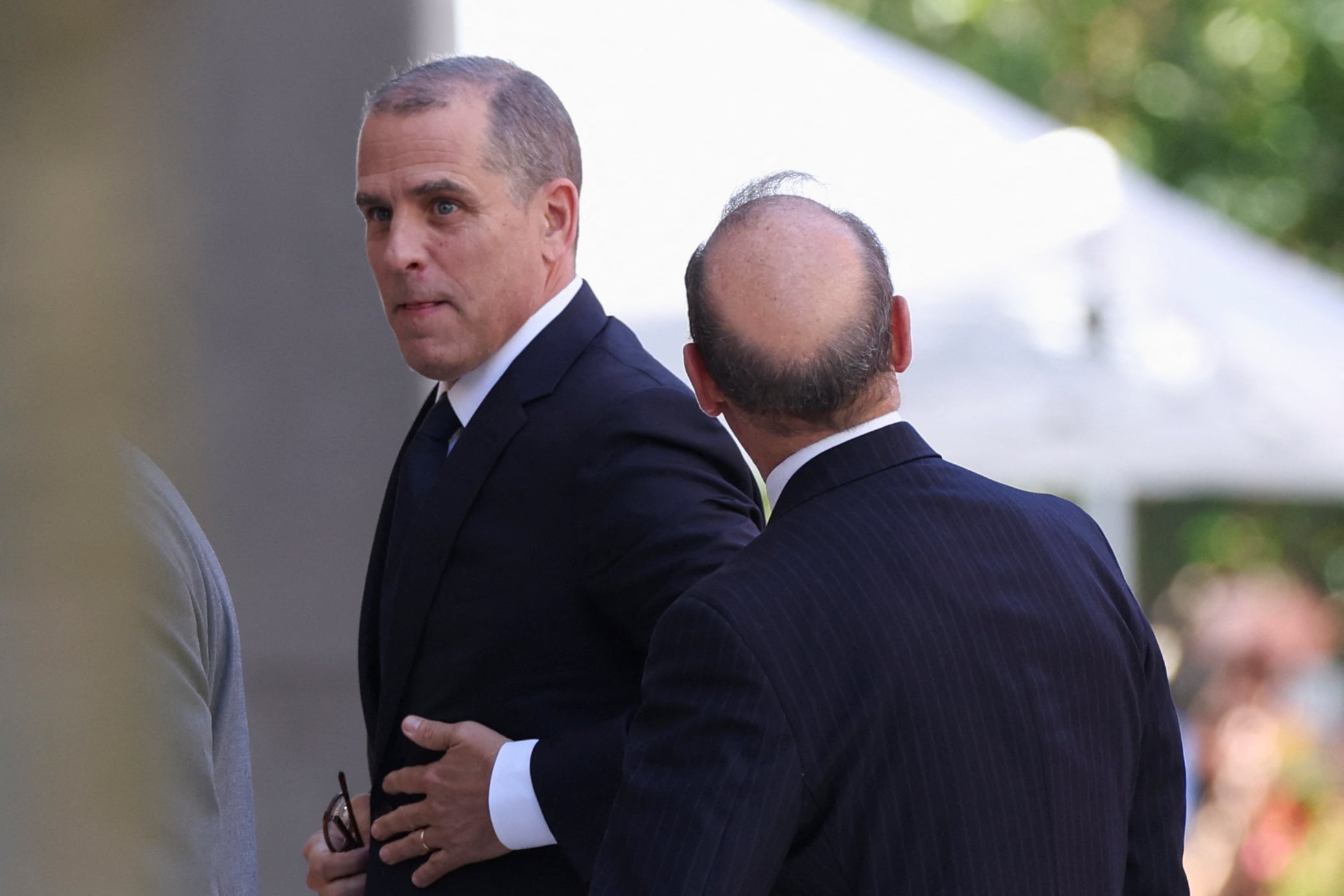 U.S. President Joe Biden's son, Hunter Biden, walks to appear in a federal court on gun charges in Wilmington, Delaware, U.S., October 3, 2023. 